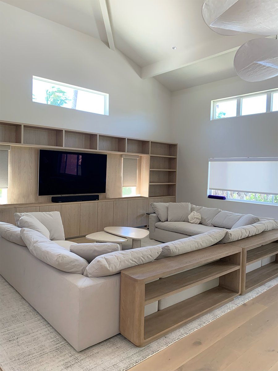 The built in media center of this living room creates a focal point while blending seamlessly into the zen design of the overall home.