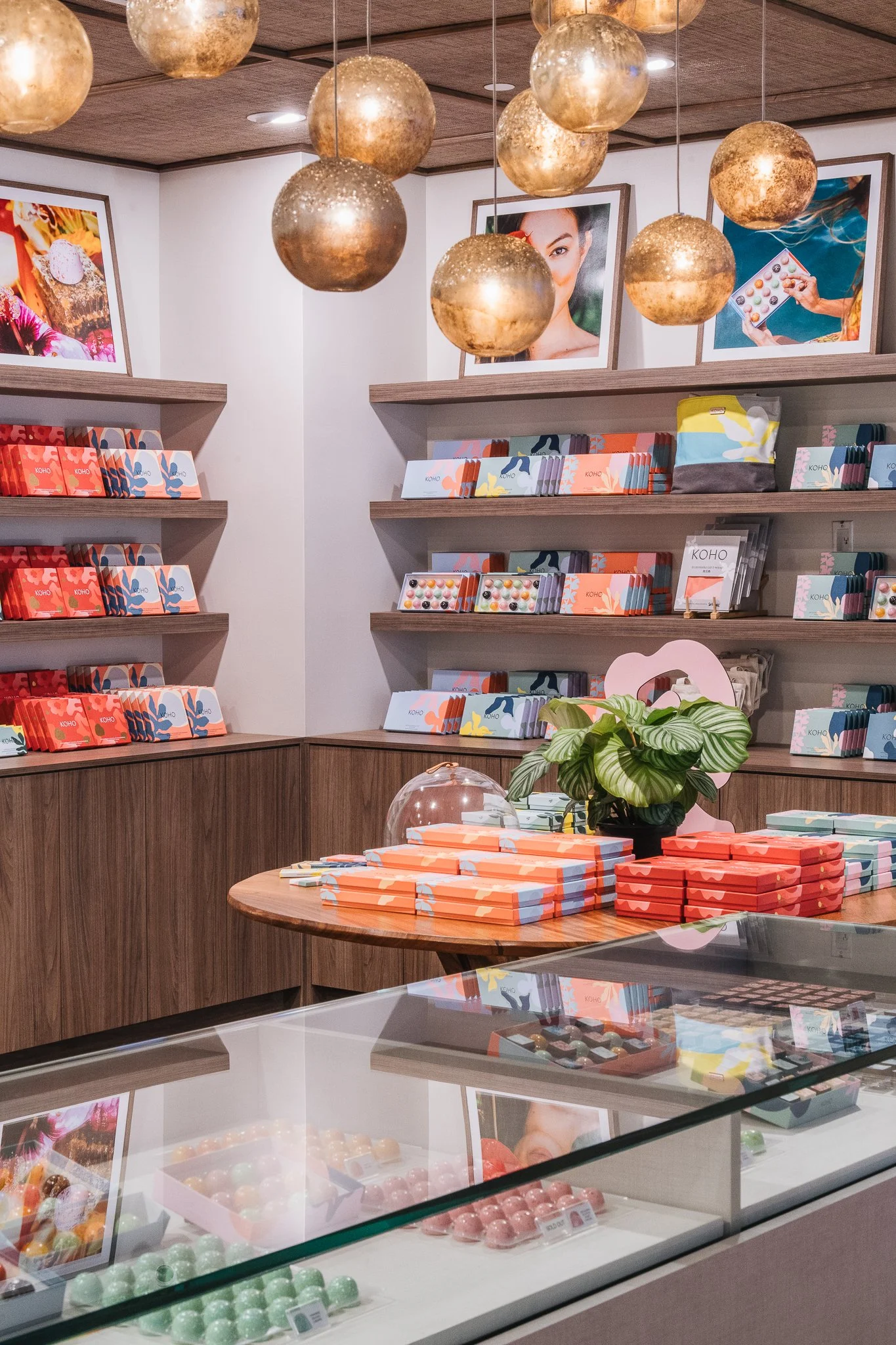 Warm wood custom built-ins relate to the richness of Koho's chocolates.