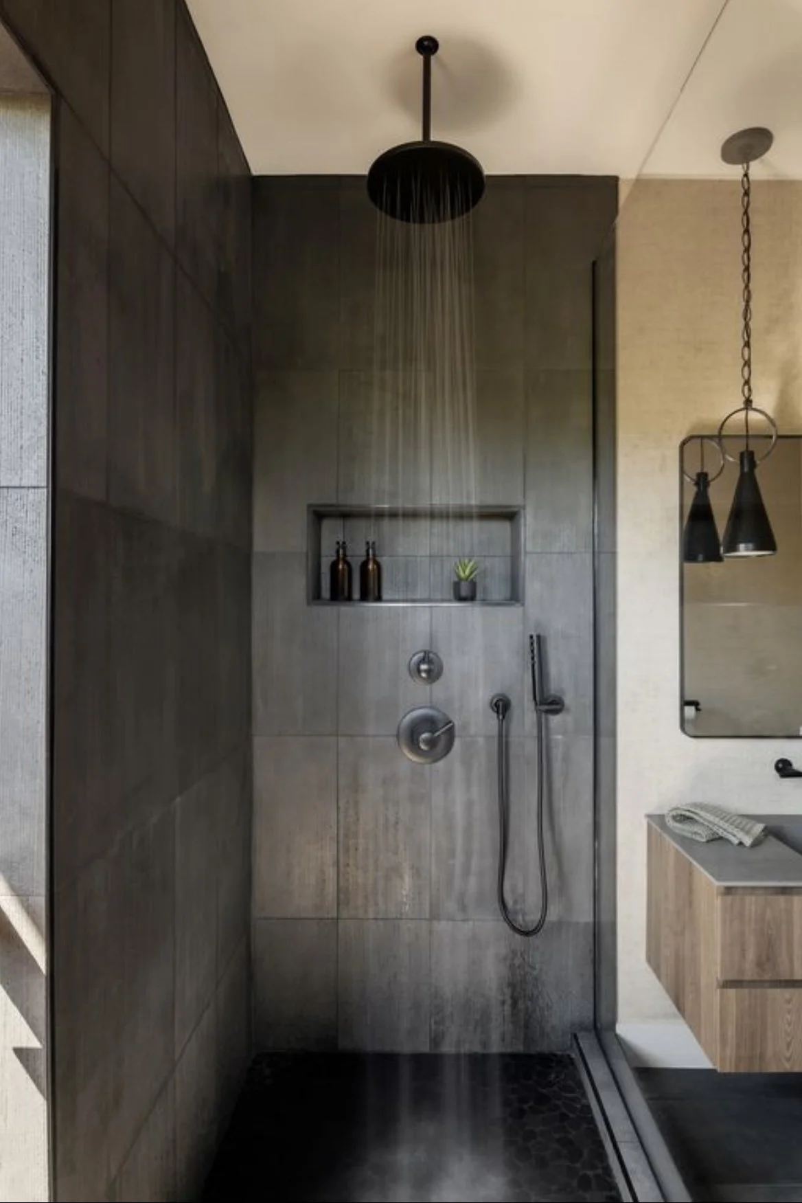 This master bathroom features basalt tile that ties into the lava of the Hawaiian islands.