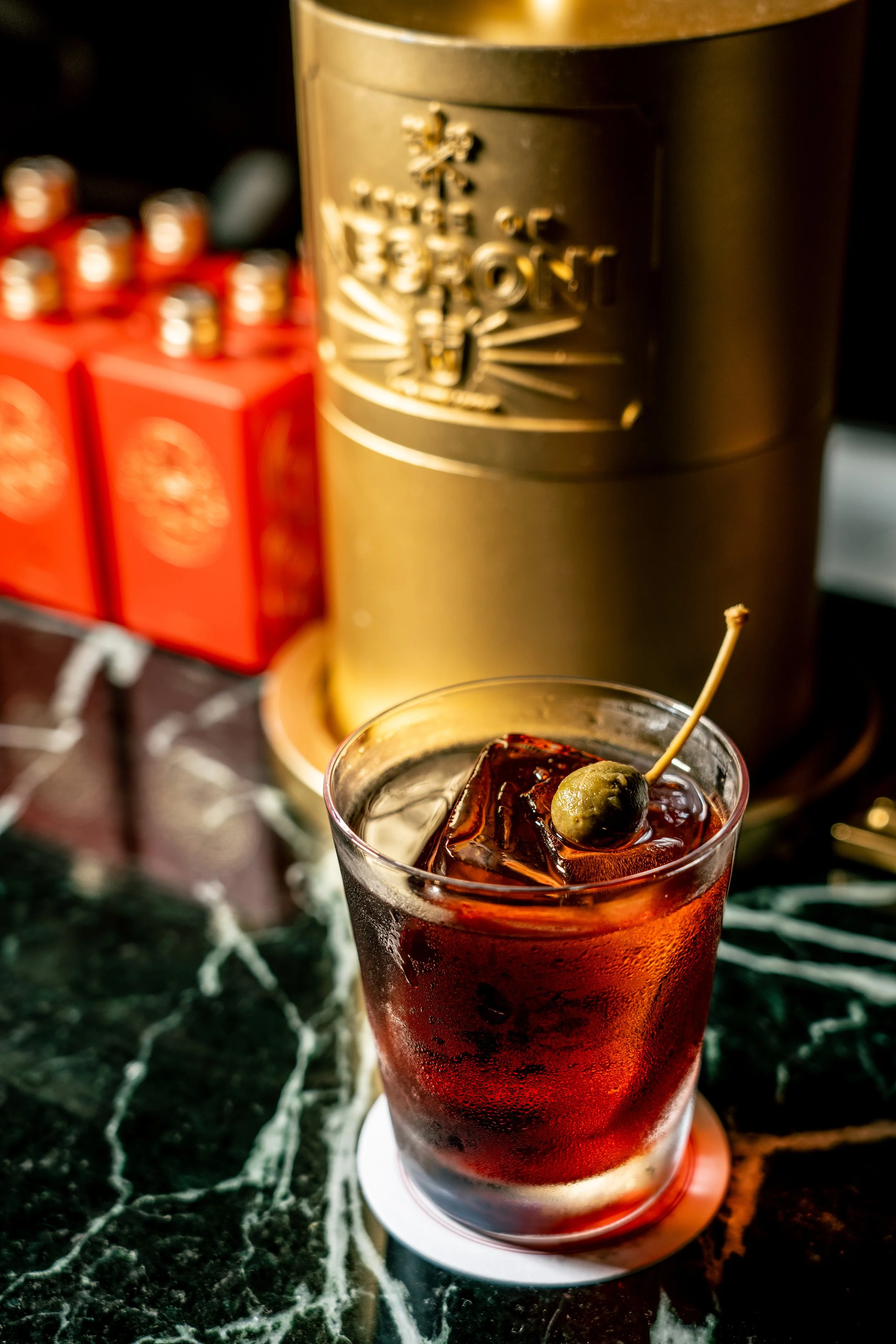 Negroni served with caper