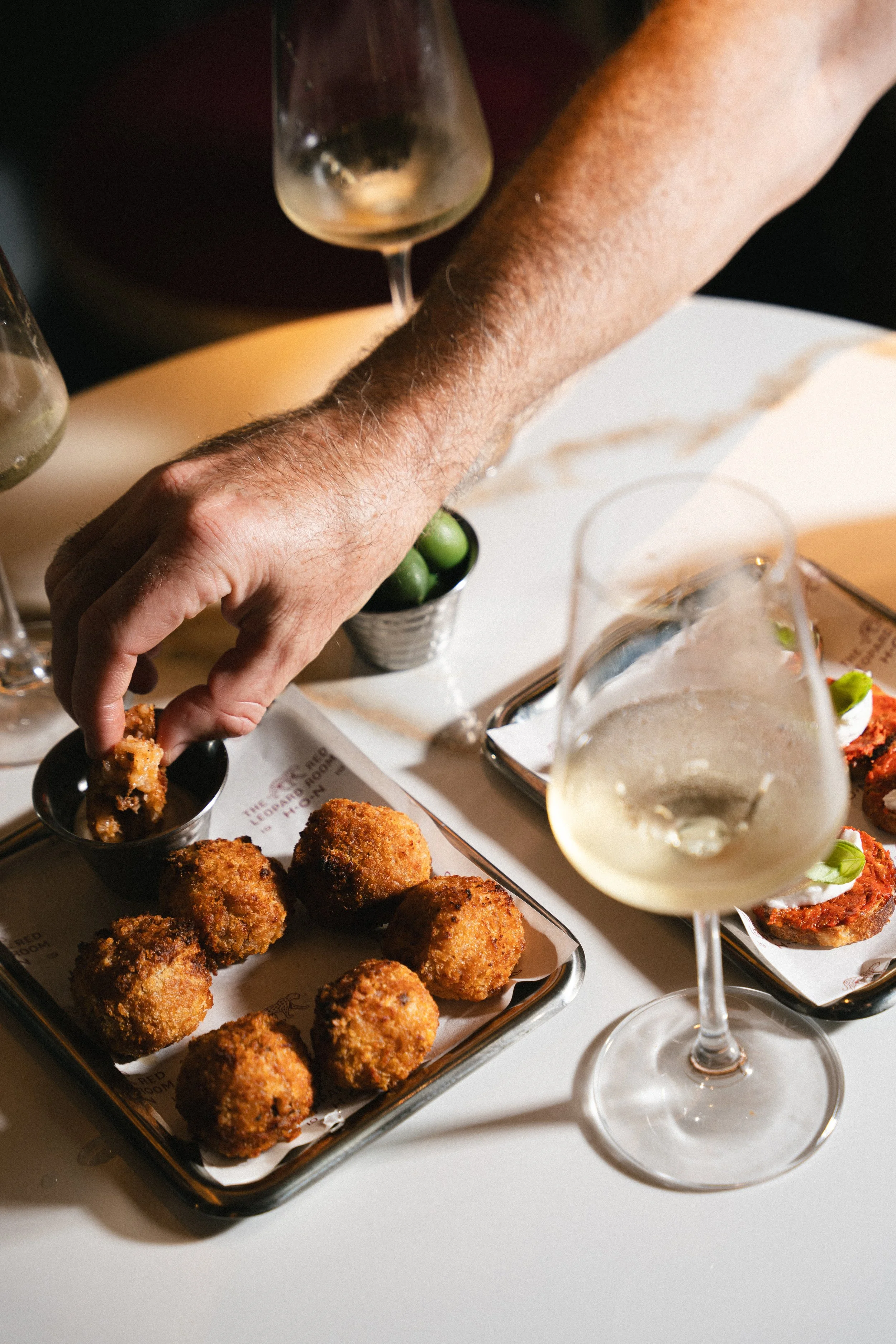 Arancini and a glass of white wine