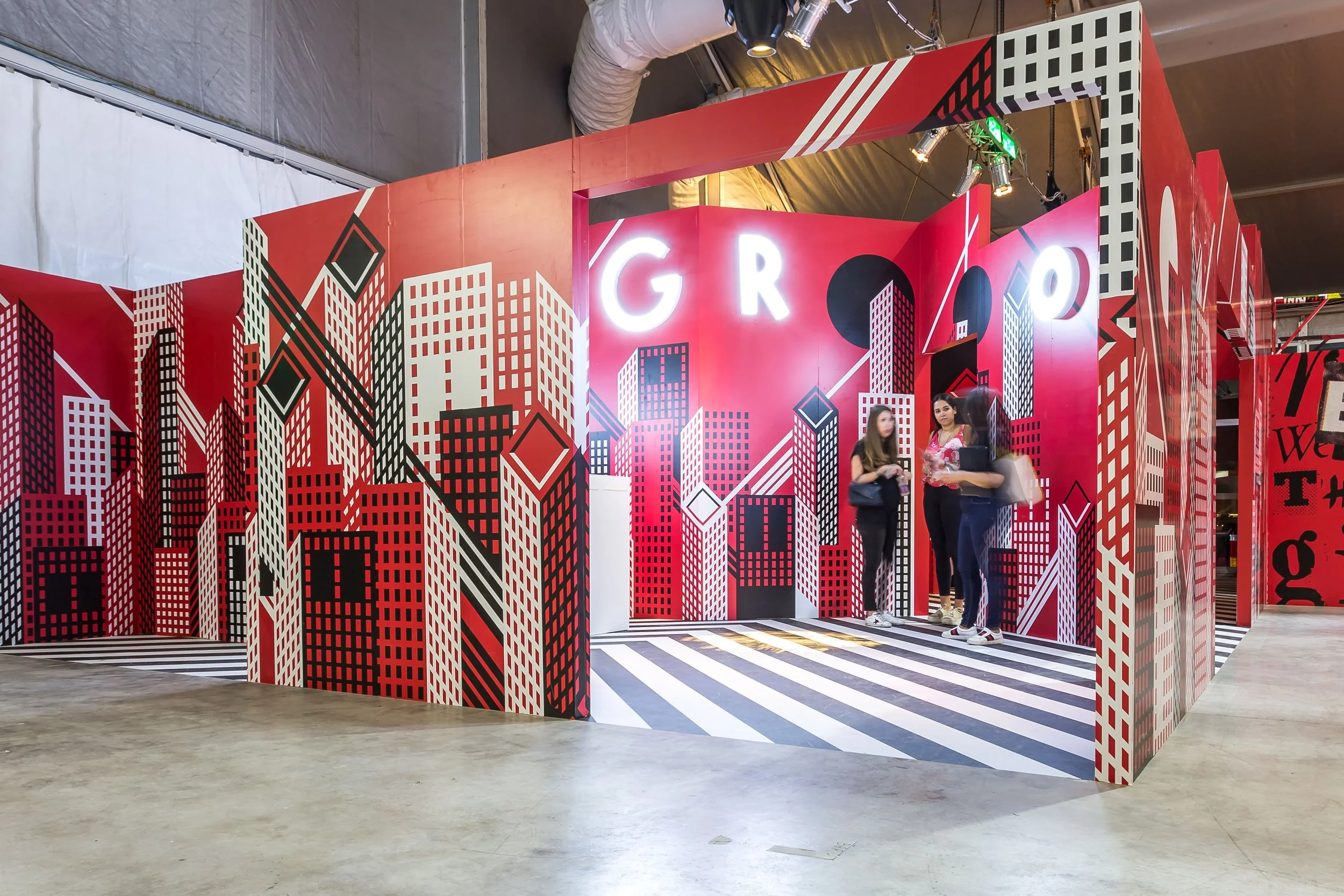 A red installation with graphic design embellishments in a modern style