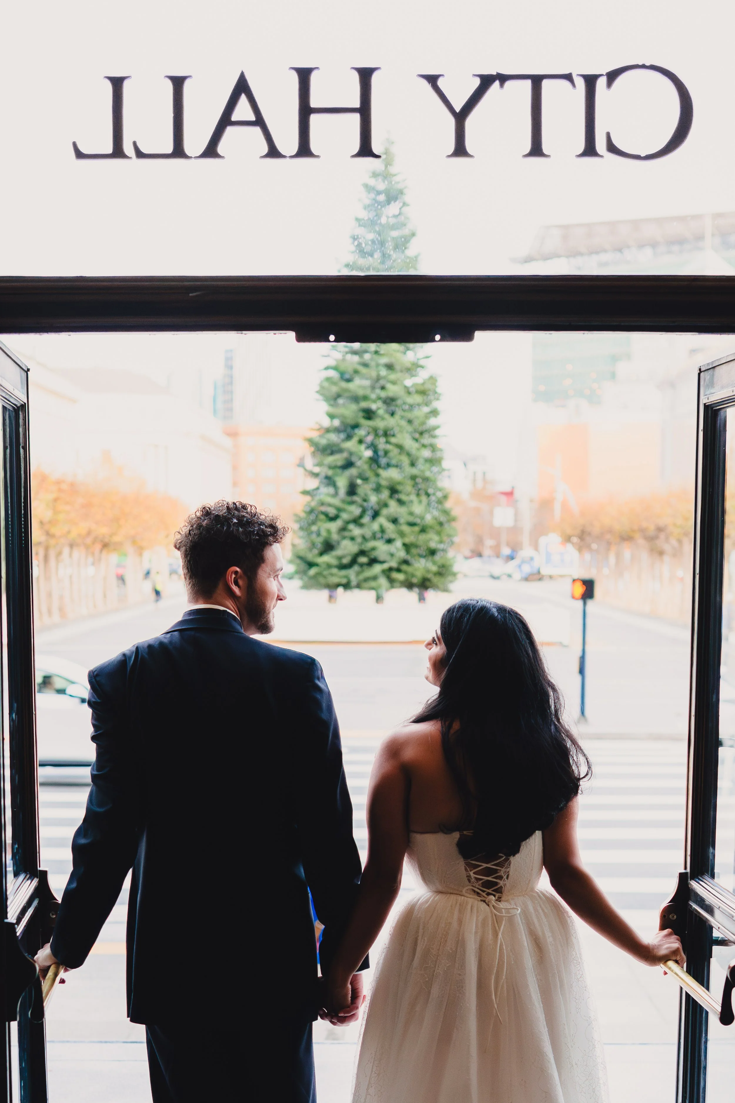 Newlyweds exit San Francisco City Hall
