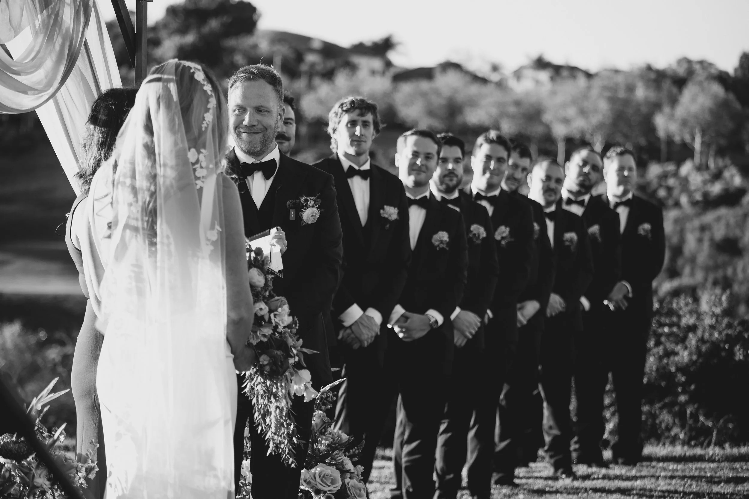 Bride and groom with groomsmen at the ceremony