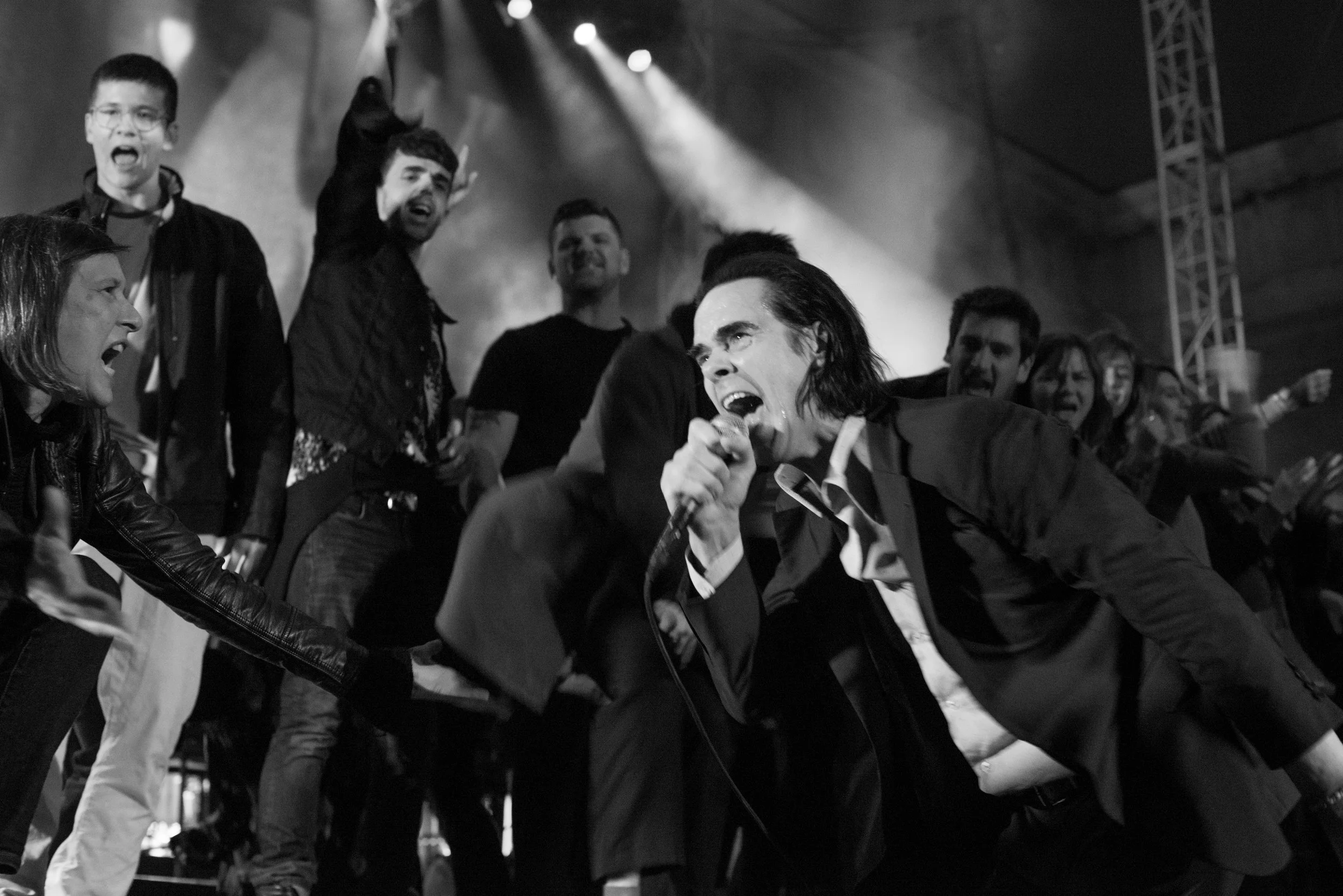 NIck Cave with fans on stage at the Greek Theater in Berkeley in 2017