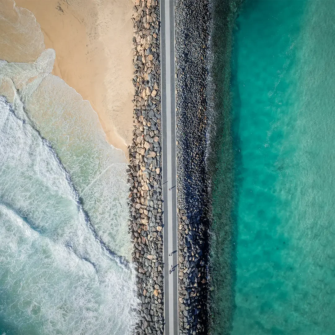 Image shows a top down aerial view of a coastal environment.