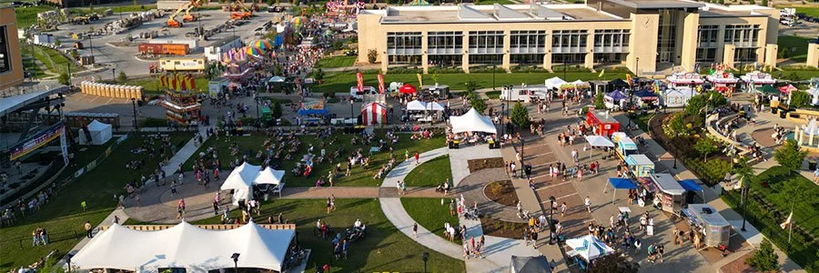 tents and a large crowd of people at a local event in Ankeny Iowa
