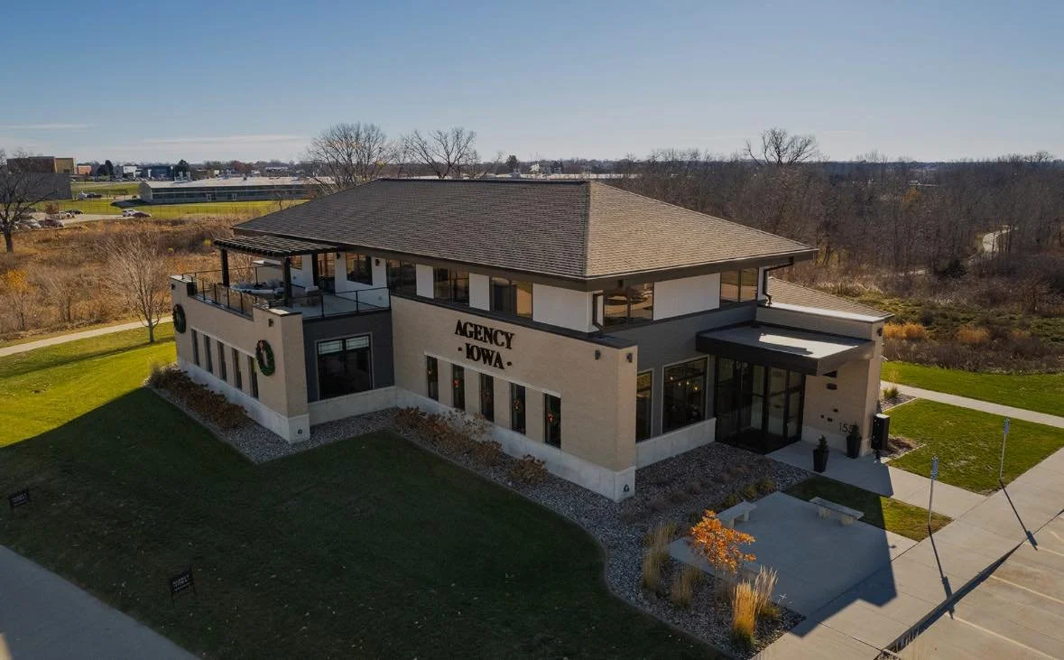 coming soon typed on white paper held up with two hands against a blue sky background