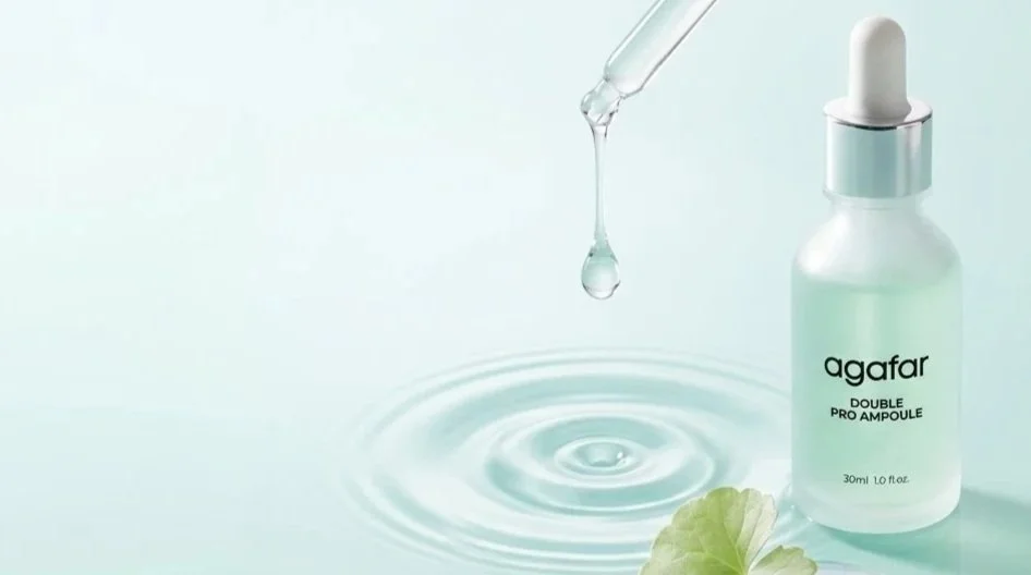 Serum_drop_falling_into_water_202608152322.jpg