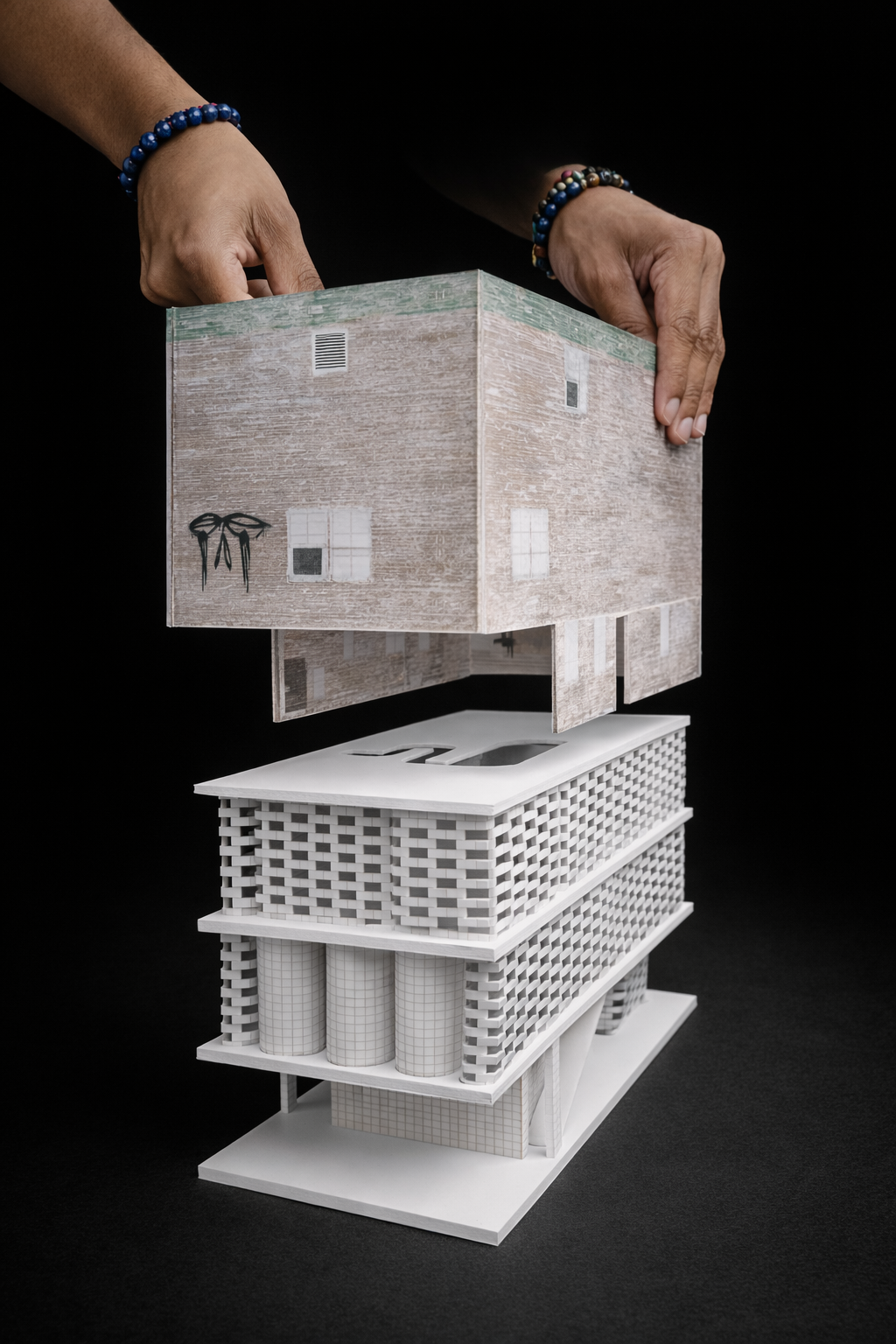 The building’s facade is made of printed glass that mimics the look of a 'run-down' structure, while the interior is finished in porus exposed brick