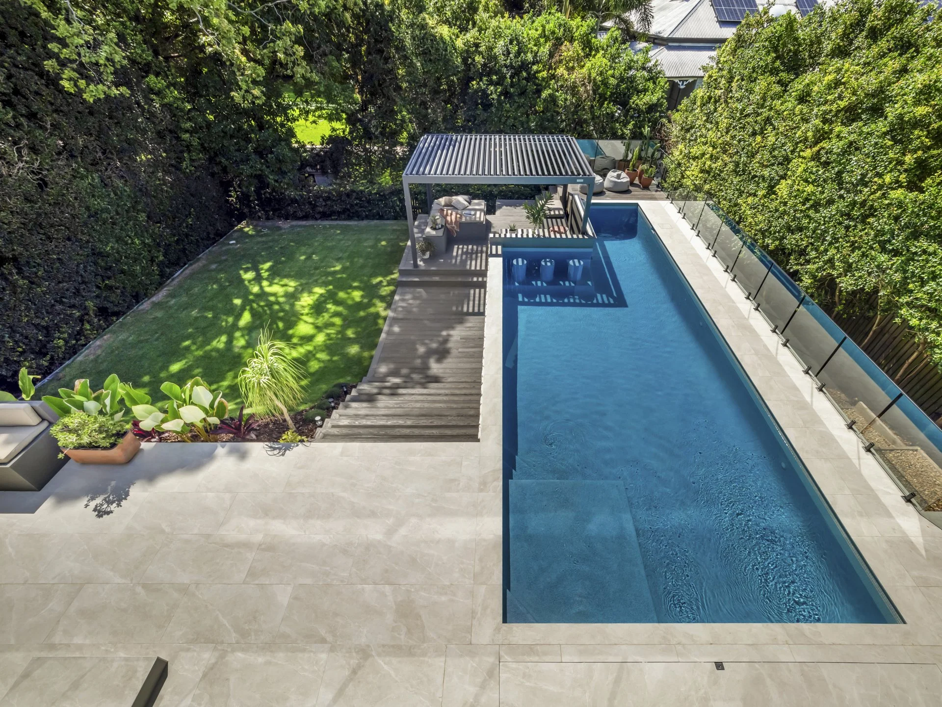 Aerial view of a custom concrete swimming pool, constructed by Swim Sooner in Brisbane. 