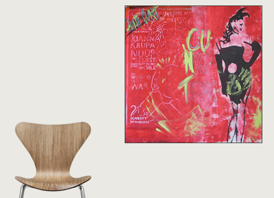 A wooden chair with a curved backrest on the left and a colorful abstract painting on the wall on the right.