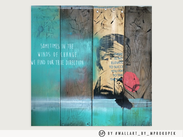 Street art mural on wooden panels featuring a silhouette of a man with speech text, a red balloon, and abstract designs in shades of blue, brown, and beige.