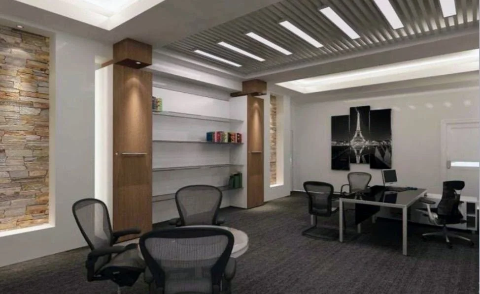 Modern office space with desks, chairs, wall art of Paris, and built-in shelves.