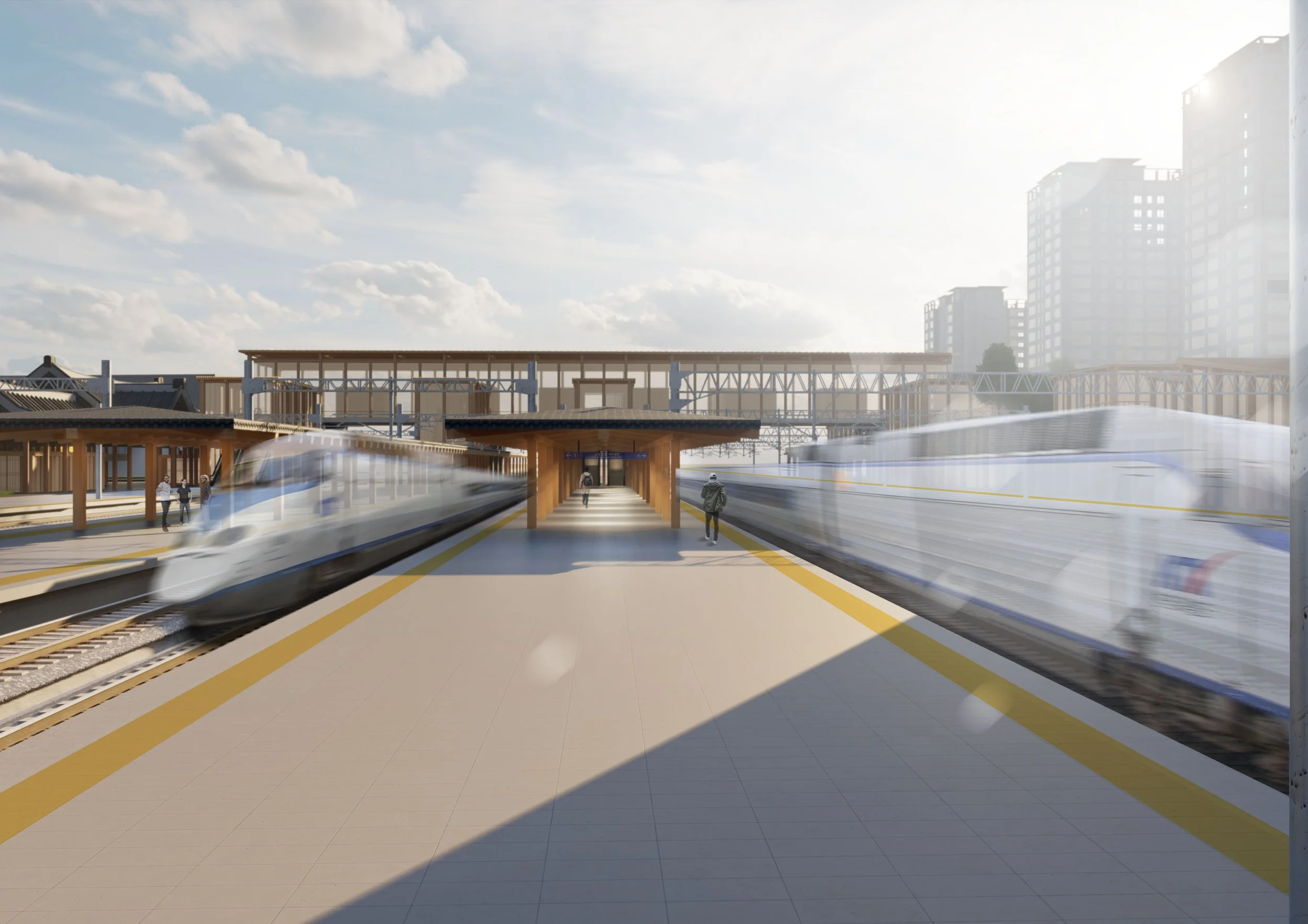 A modern train station with two moving trains on either side and a central walkway with pedestrians, under a partly cloudy sky with tall buildings in the background.