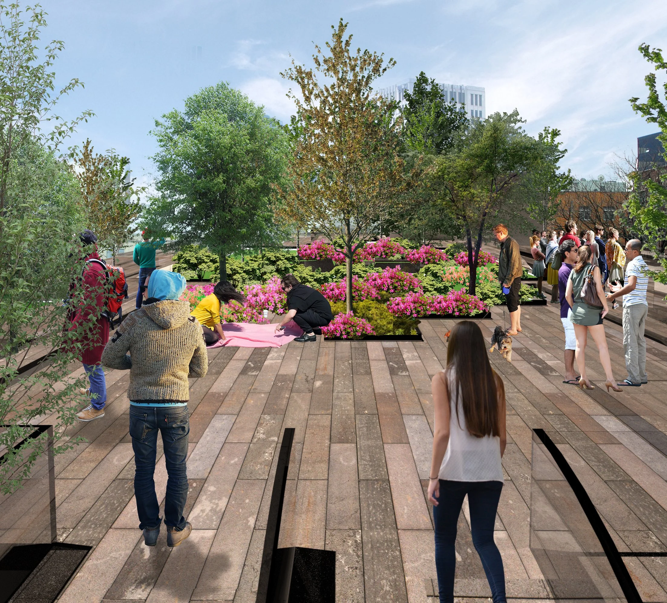 People gathering in a city park with blooming pink flowers and green trees on a sunny day.