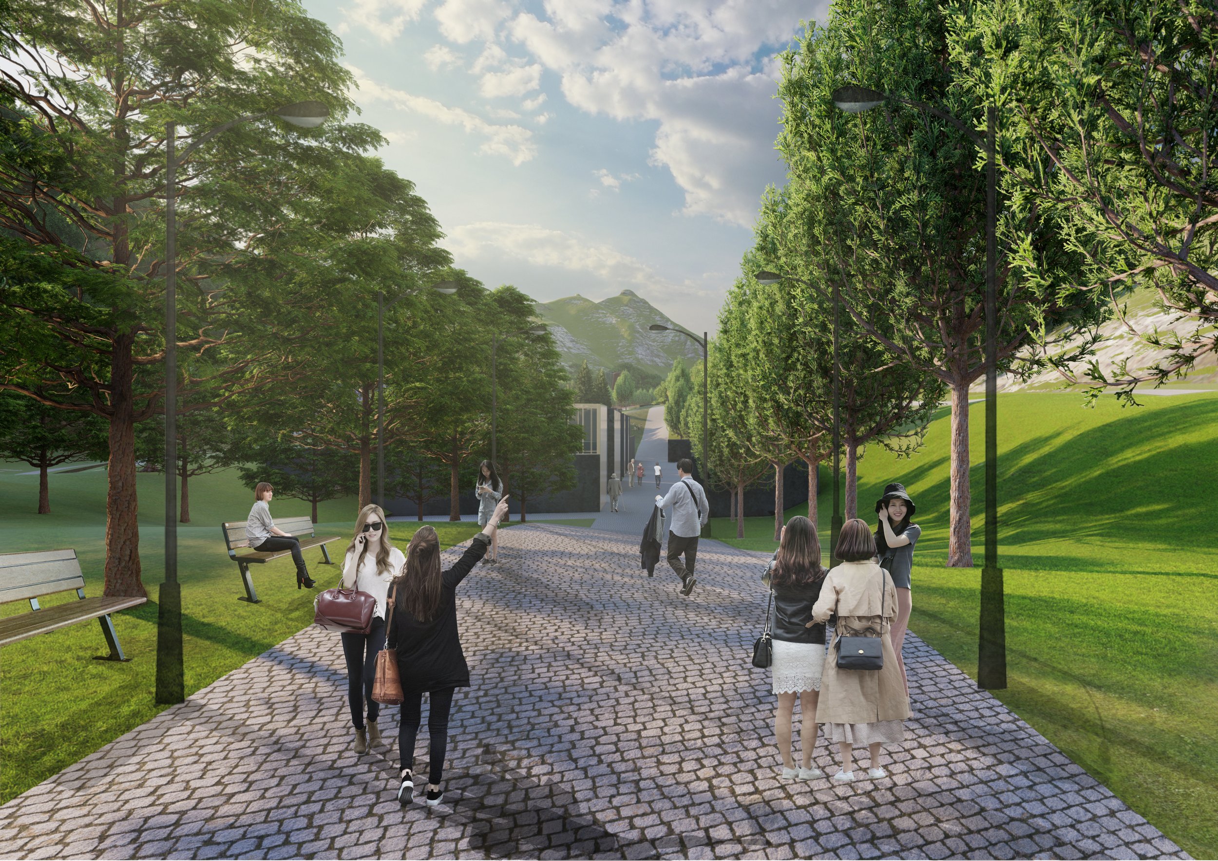 A park pathway with cobblestone pavement, trees on both sides, and people walking and chatting on a sunny day in a hilly landscape.