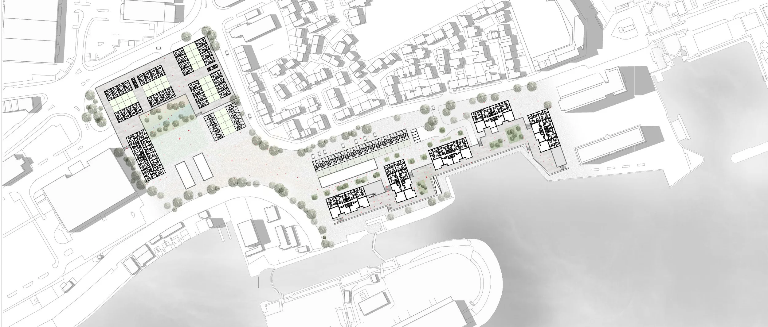 Site plan of an urban area with buildings, green spaces, trees, and a waterfront.