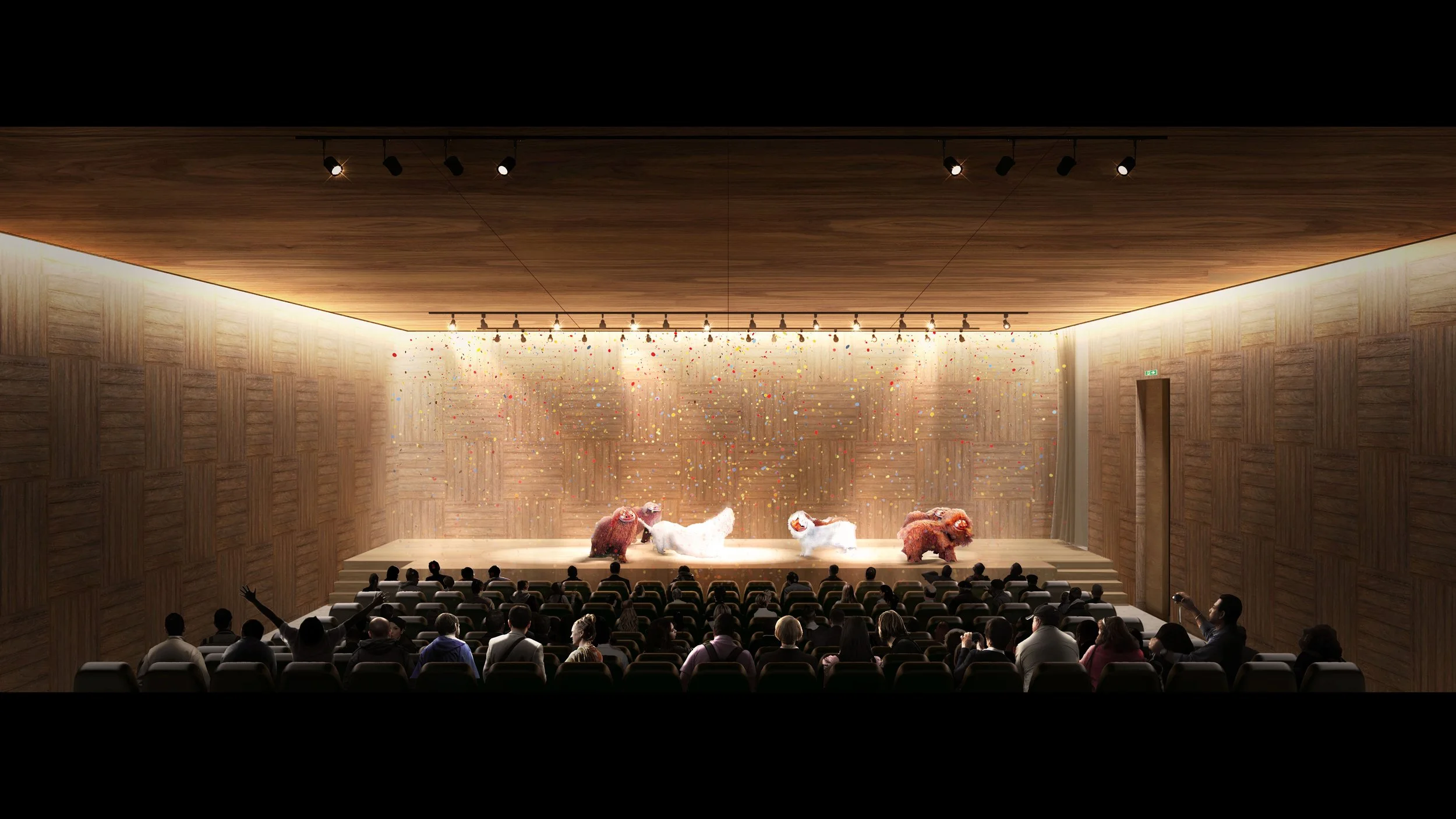 Animal performers on stage in a theater, with confetti falling, audience members watching and taking photos.