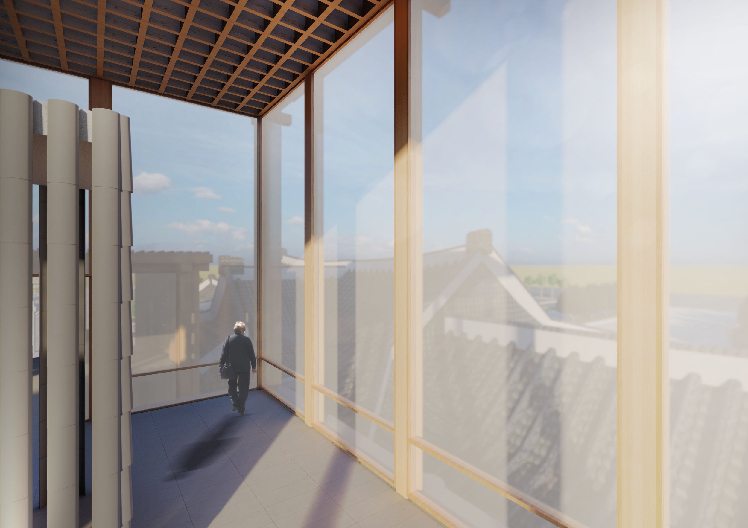 Interior of a modern building with large glass windows, a man walking, and a slanted wooden ceiling.