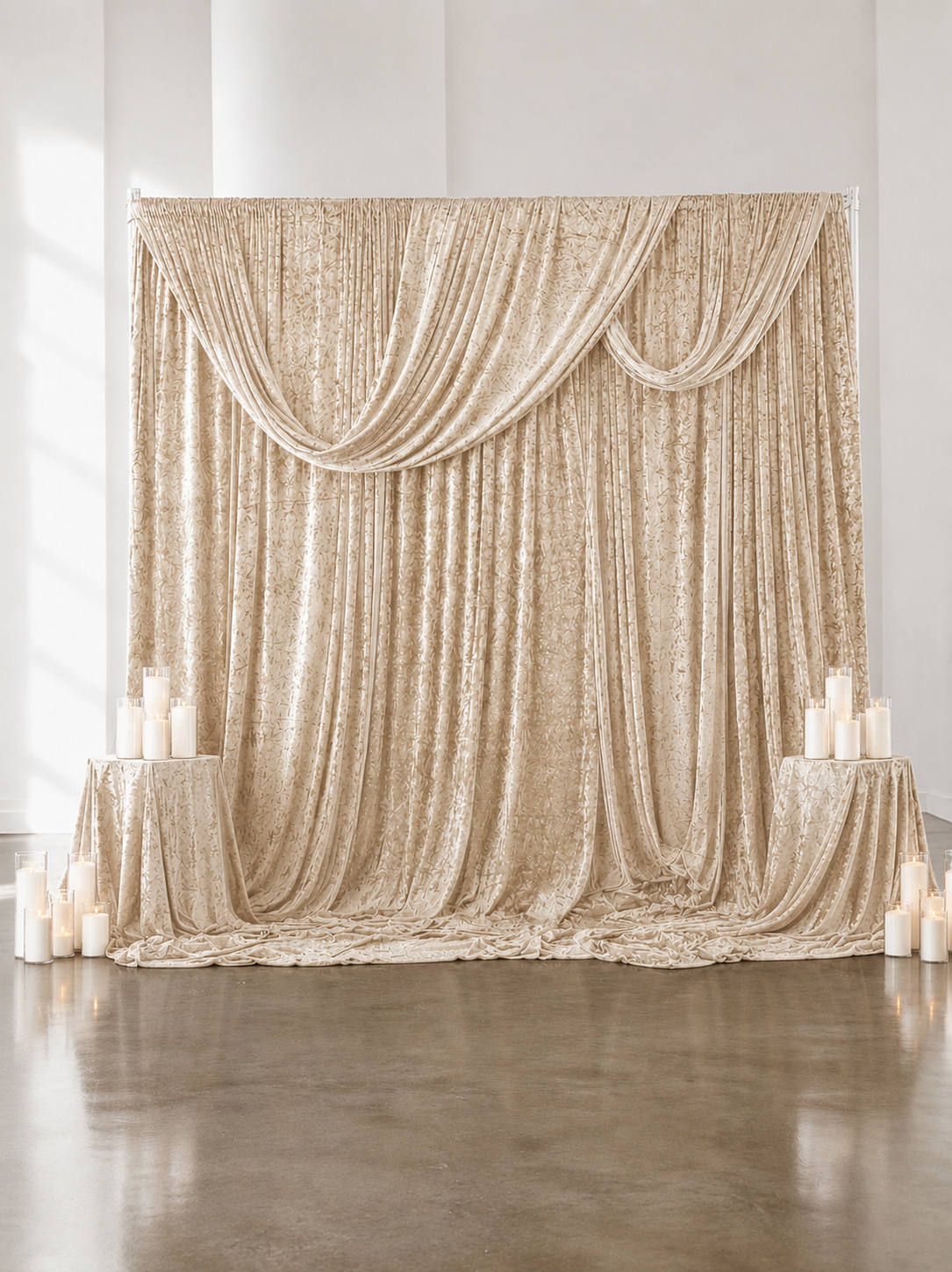 Champagne  Drapery Backdrop 10ft by 10ft with 35 Sandwax candles and 4 Draped Pedestals- $400.00