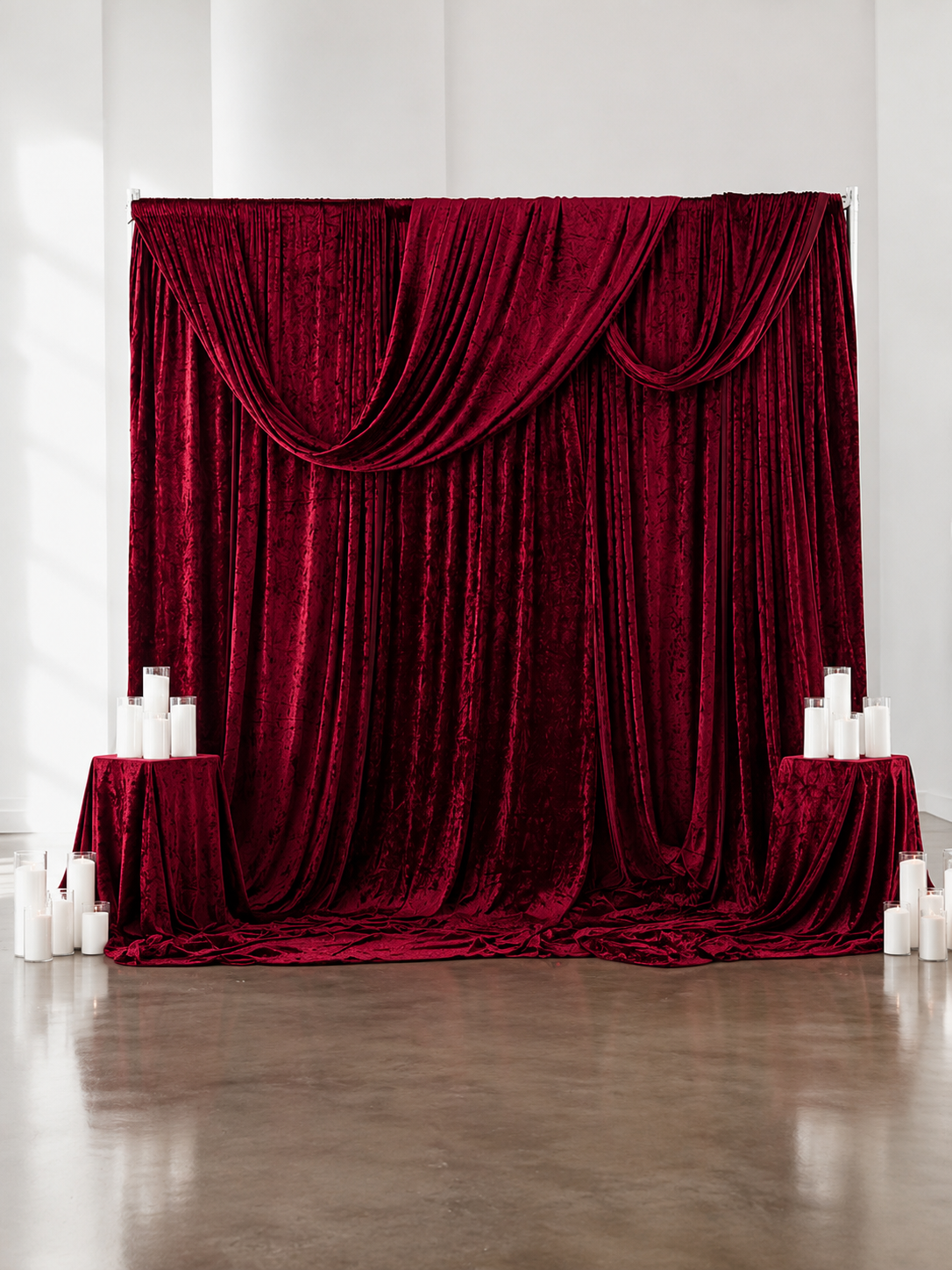 Red Drapery Backdrop 10ft by 10ft with 35 Sandwax candles and 4 Draped Pedestals- $400.00