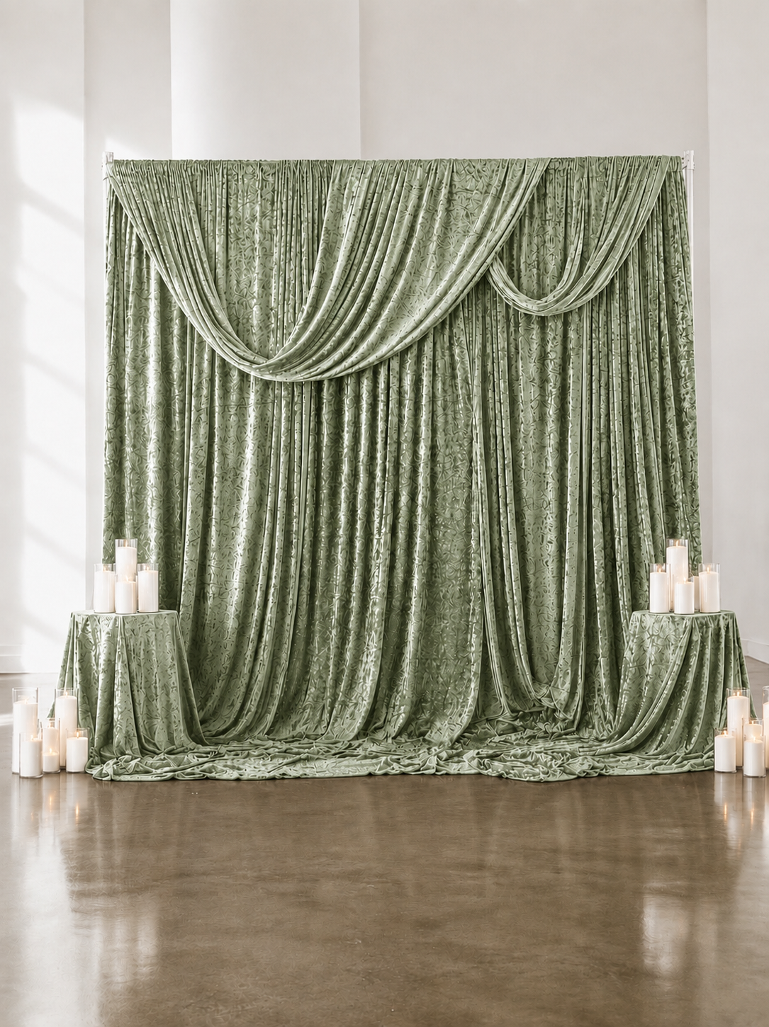 Sage Dapery Backdrop 10ft by 10ft with 35 Sandwax candles and 4 Draped Pedestals- $400.00