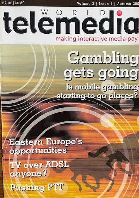 Cover of a magazine titled 'World Telemedia' with headlines about gambling, Eastern Europe's opportunities, TV over ADSL, and pushing PTT, featuring a silhouette of a horse and rider against a sunset background.