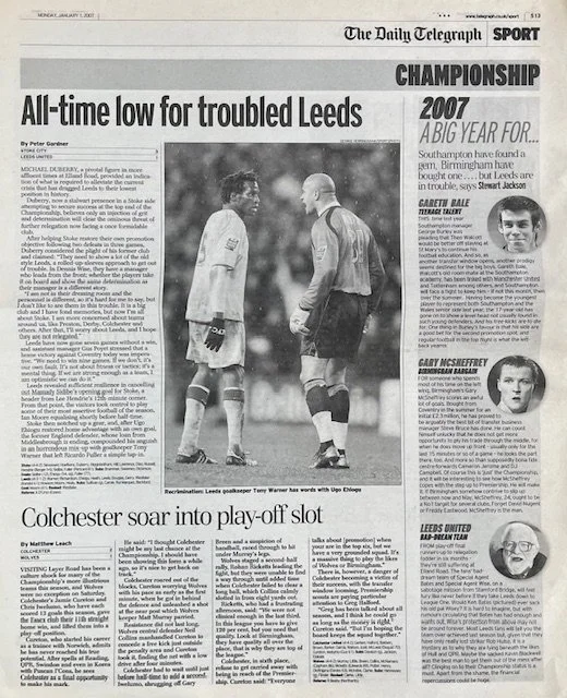 A newspaper article titled 'All-time low for troubled Leeds' shows a black-and-white photo of a football player and a referee or official on the field, engaging in a discussion.