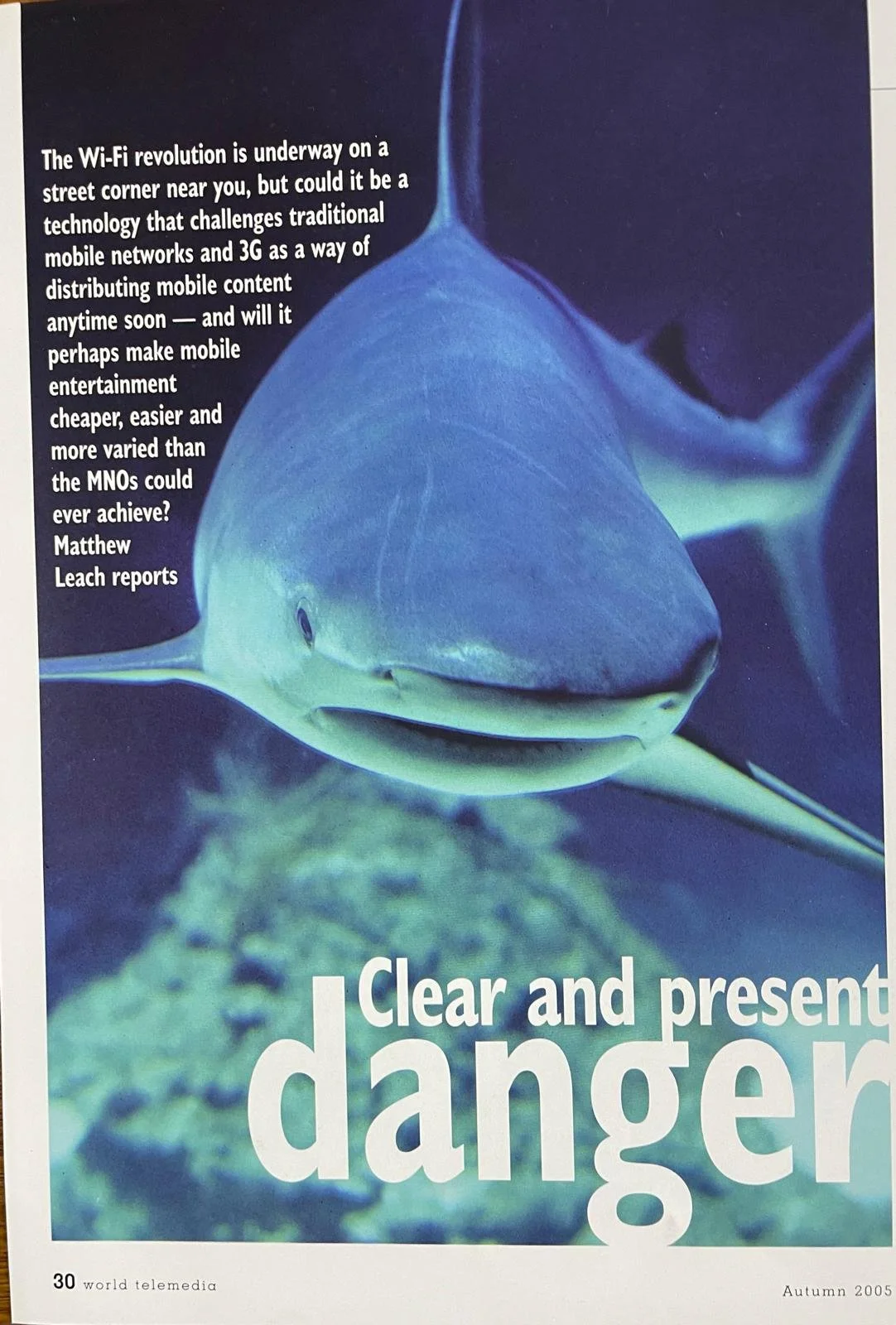 A picture of a shark underwater with text discussing Wi-Fi revolution and digital content distribution.