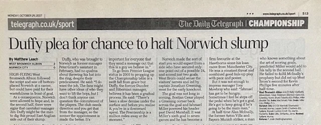 Close-up of a sports newspaper page with an article titled 'Duffy plea for chance to halt Norwich slump' from The Daily Telegraph, focusing on football and a player named Duffy.