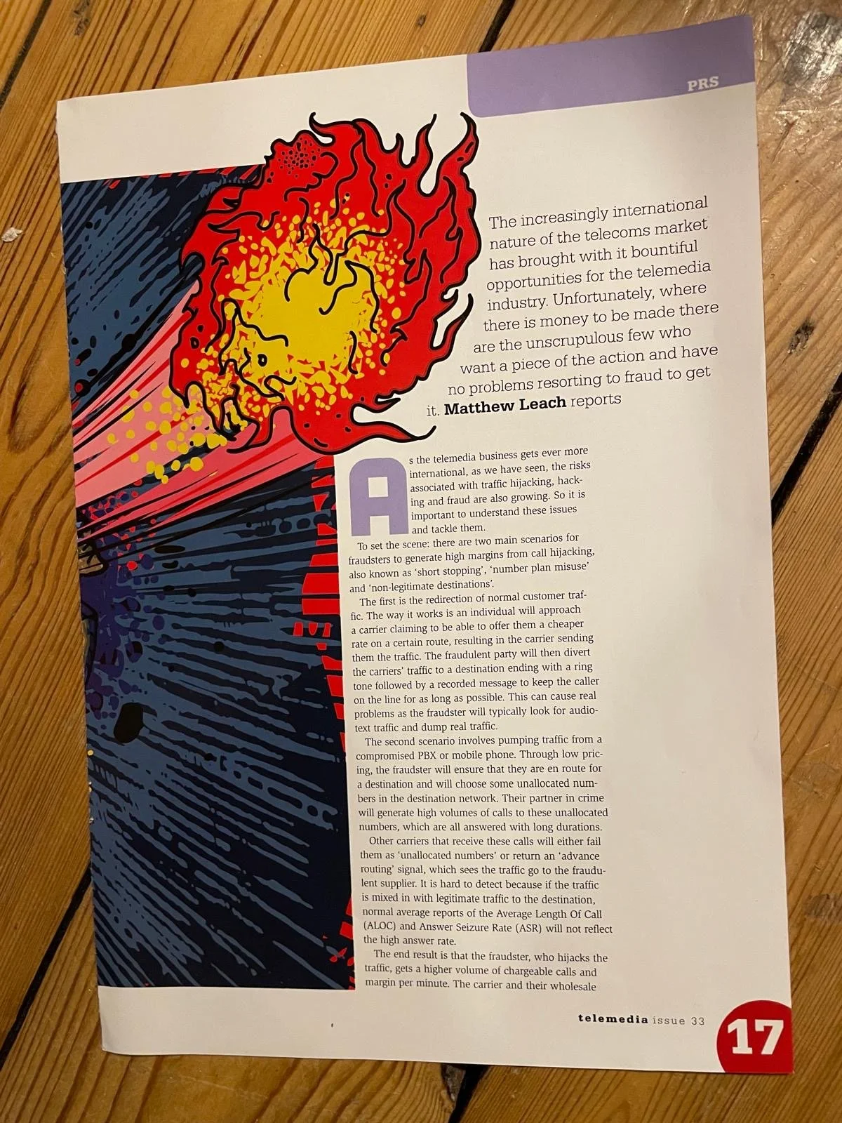 Telemedia magazine page with a colorful explosion graphic and text about telecom fraud, featuring issue number 33 and a red circle with the number 17.