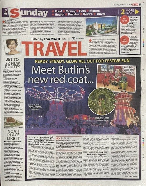 Front page of The Sunday Times newspaper focusing on travel features, including a large headline about Butlin's new red coat, a colorful photo of amusement park rides, and smaller images of people enjoying the attractions.
