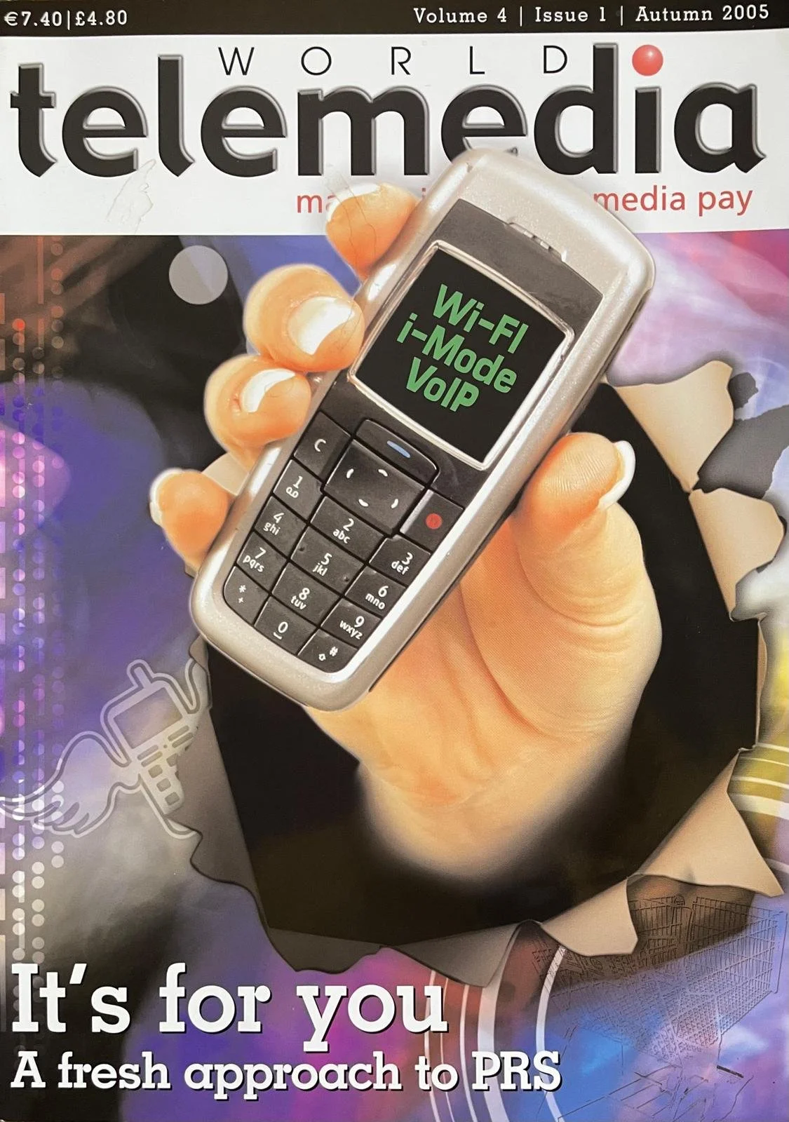 Magazine cover of 'world telemedia' from Autumn 2005, Volume 4, Issue 1, showing a hand holding a mobile phone with a screen displaying 'Wi-Fi i-Mode VoIP'. The cover has a torn-paper effect with a headline, 'It's for you,' and a subheading, 'A fresh