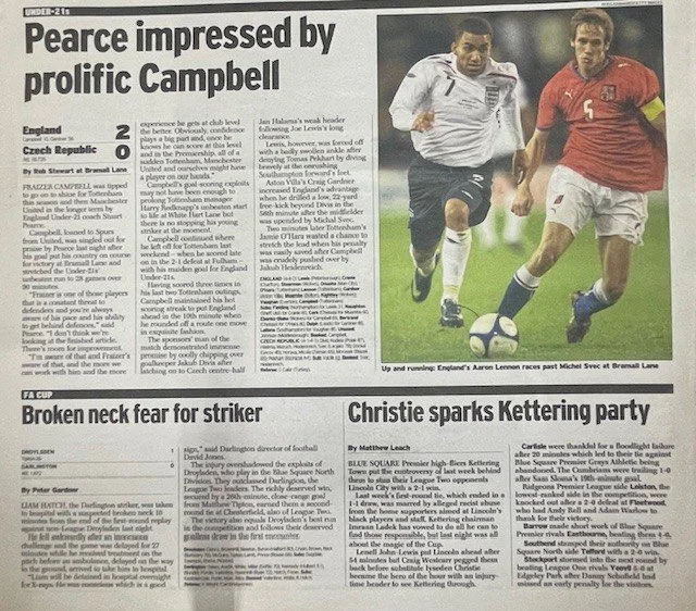 Newspaper page features a sports article with a headline about Pearce and Campbell, and two accompanying photos of soccer players in action on the field.