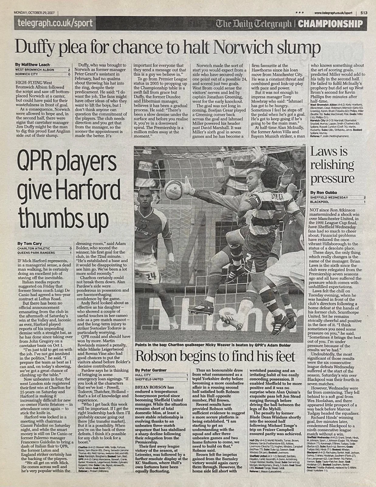 An image from a newspaper showing a soccer game with a player in mid-air heading the ball, an opposing goalkeeper diving to block, and other players nearby.