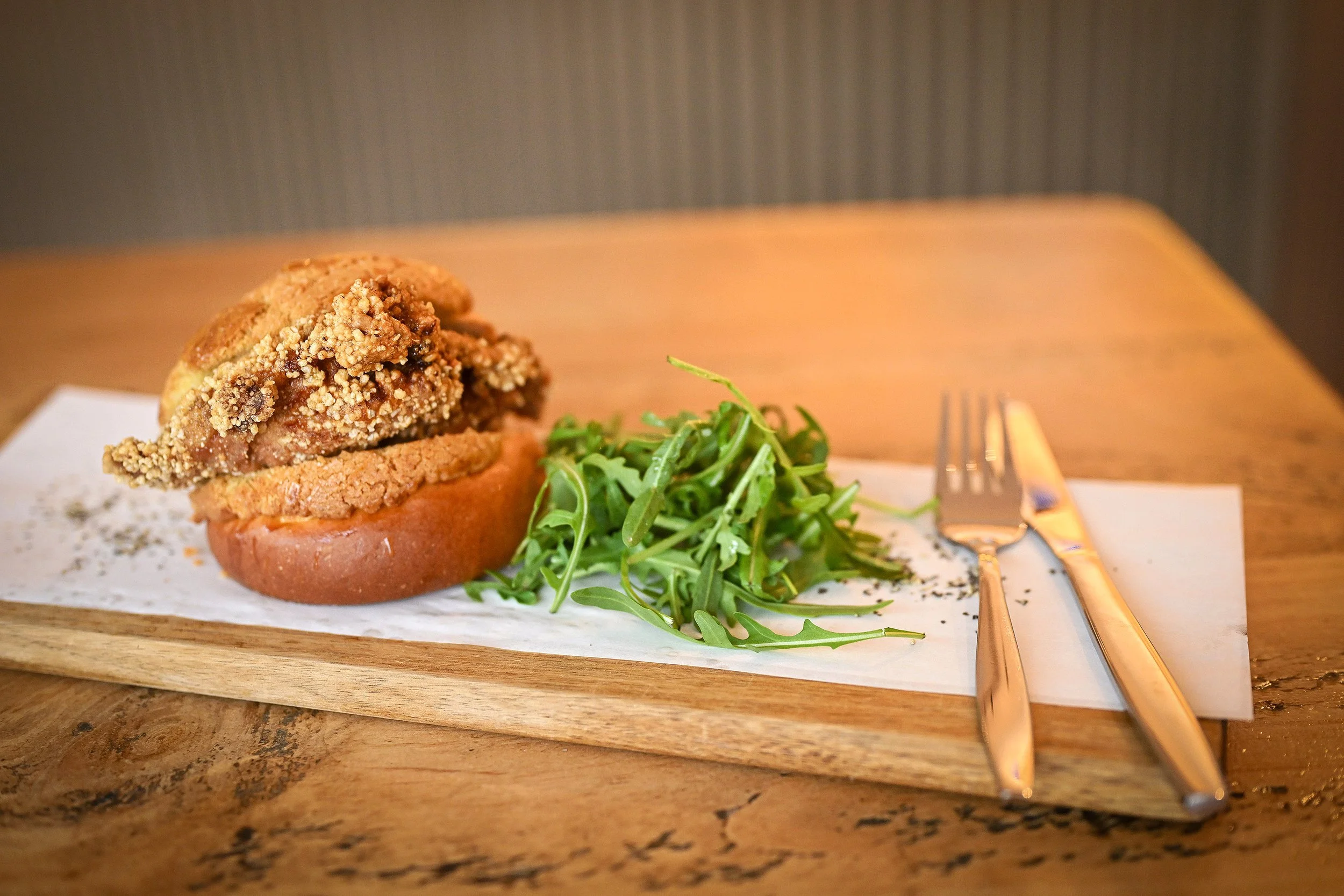 Signature dish. Freshly baked chicken Bolo Bun at Bolo & Brew café in Horsley, Surrey
