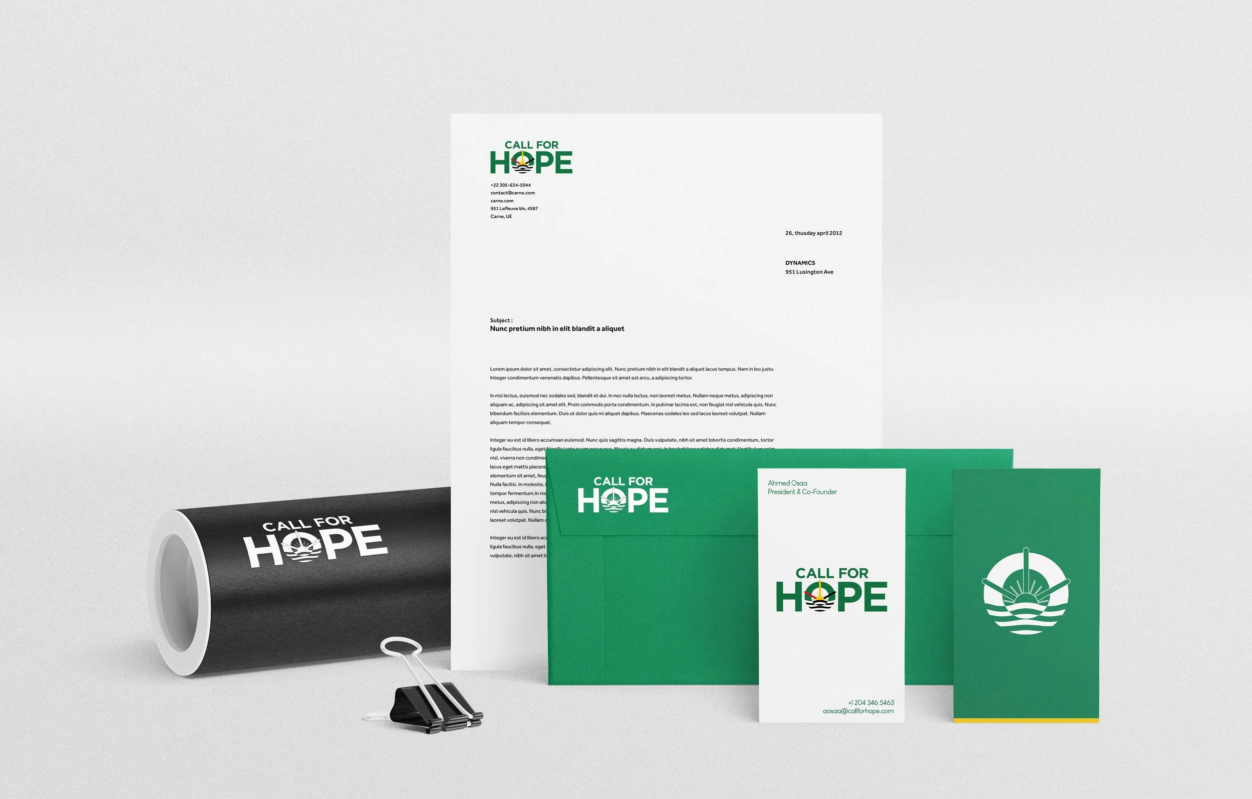 Stationery items displaying the logo and branding for 'Call for Hope', including a black and white rolled-up poster, a document with cover letter, green envelope, white business card and a green pamphlet, all with the logo featuring a stylized sun rising over water.