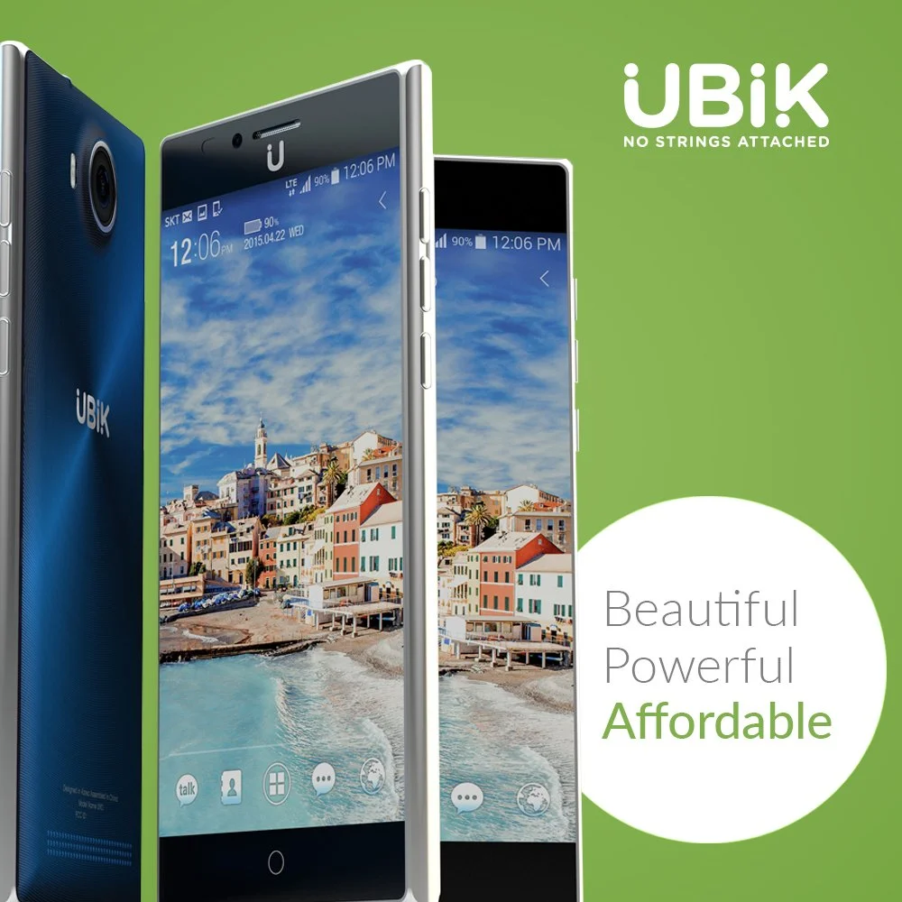 Promotional image of UBIK smartphones, one in blue and one in white, displaying a beachside town on their screens with a blue sky and clouds. The background is green with the UBIK logo, and the text "Beautiful Powerful Affordable" is visible.
