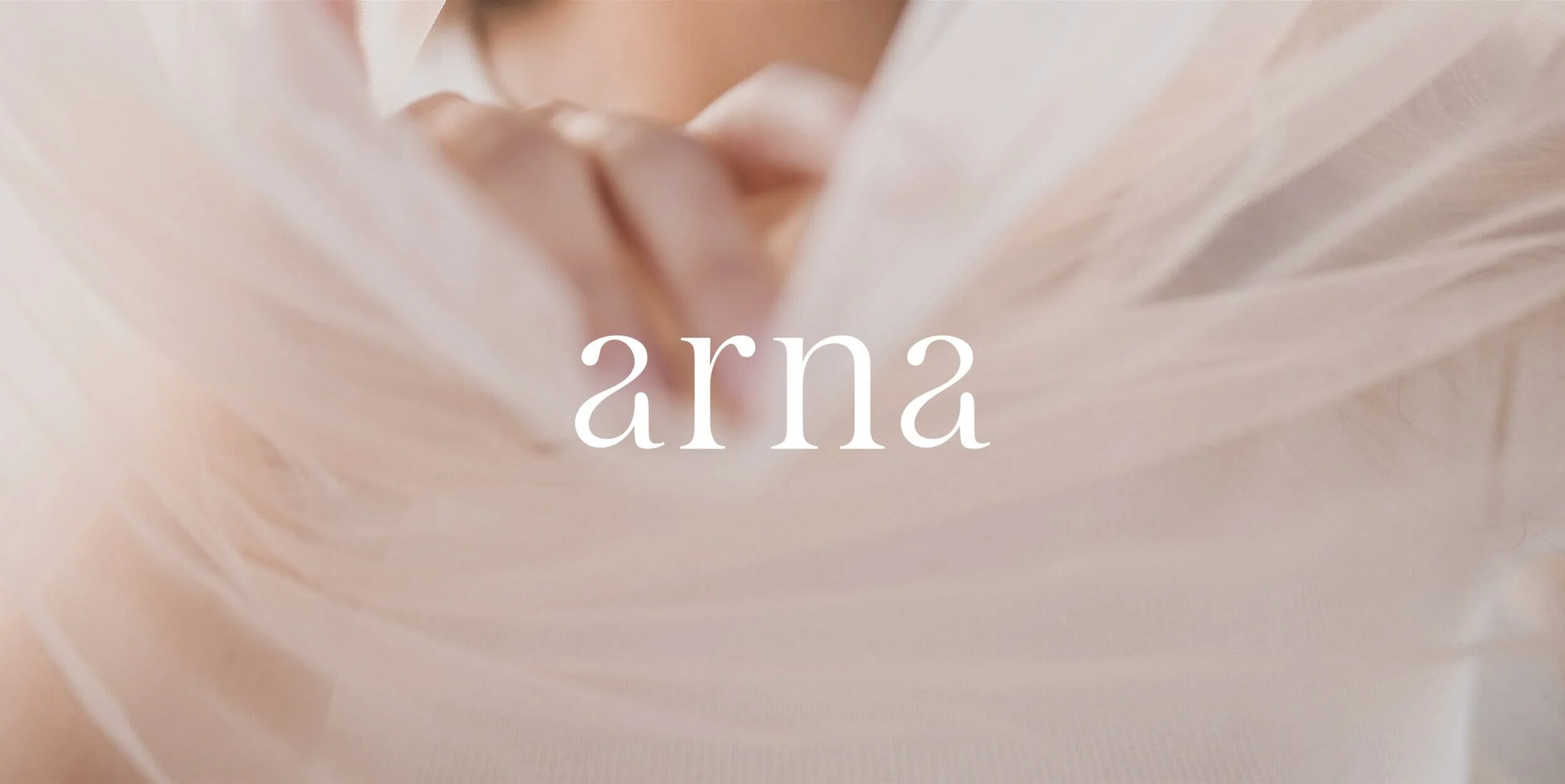 Soft pink background with the word 'arna' in the center in white lowercase letters.