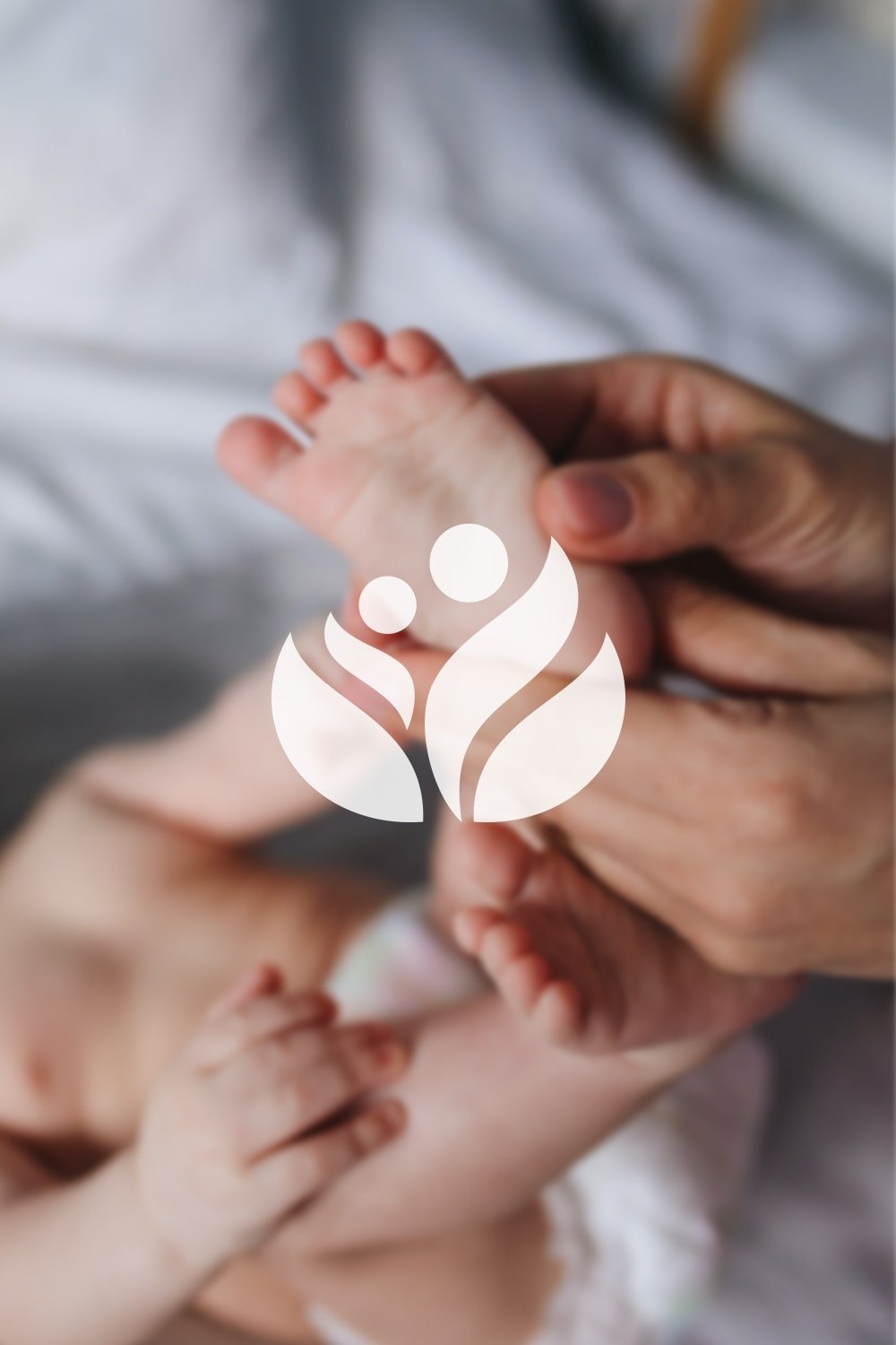A close-up of a newborn baby's foot being held by adult hand, with a white logo of a mother and child figure overlaid.