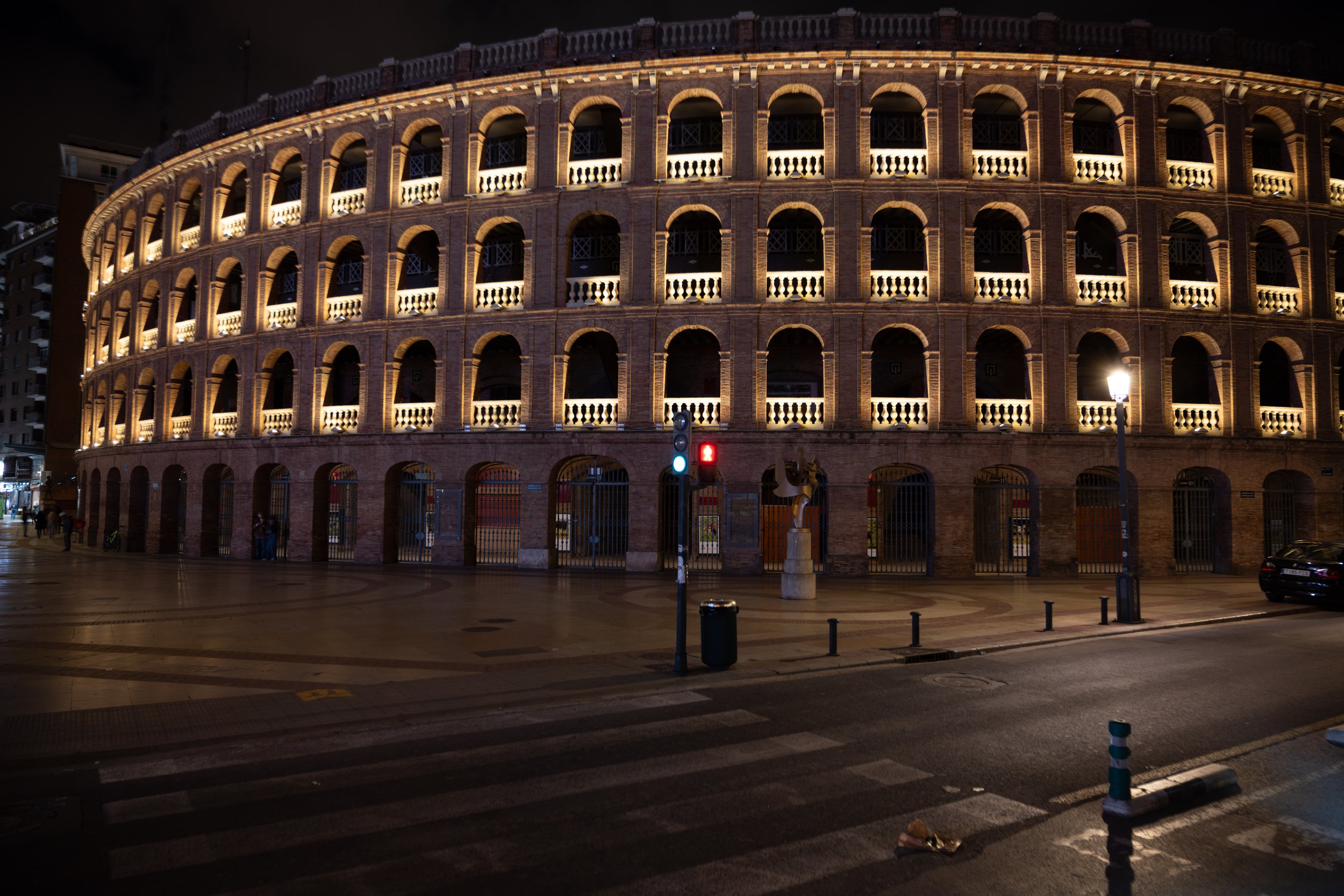 Night view of the Roman Colosseum in Rome, illuminated and empty of visitors.