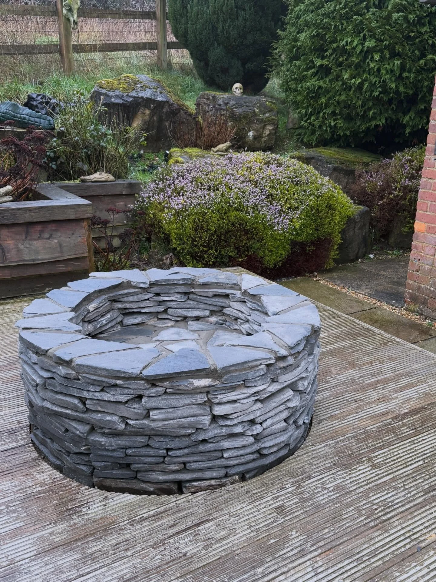 Thoroughly enjoyed building this custom fire-pit. Achieved a great drystone walling finish using blue slate from the Lake District.  #landscaping #firepit #drystone