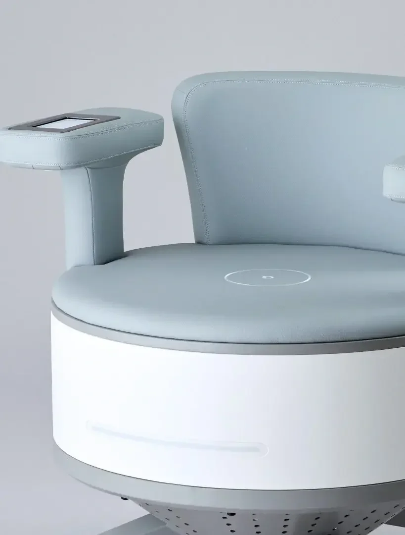 A modern, light blue and white medical or tech chair with a built-in touchscreen display on the armrest.