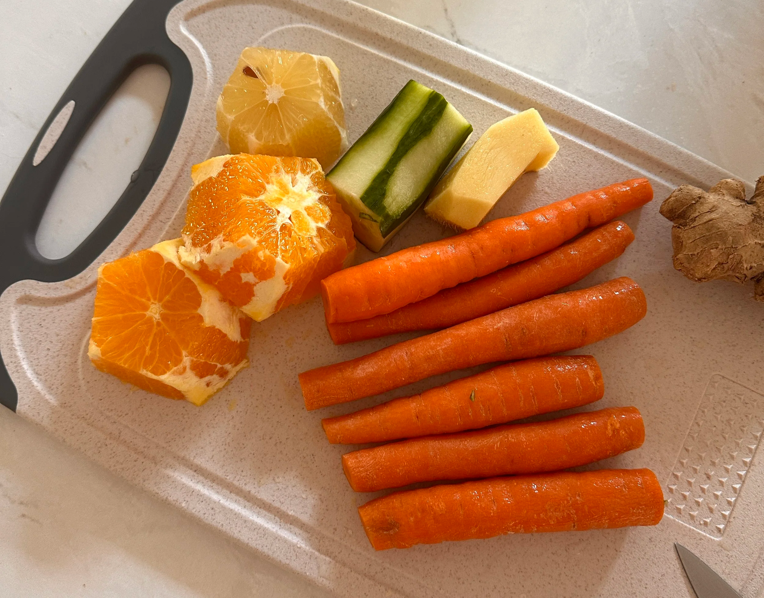 Ginger, carrots, lemon, cucumber, and orange are the base for this morning wellness juice for runners.