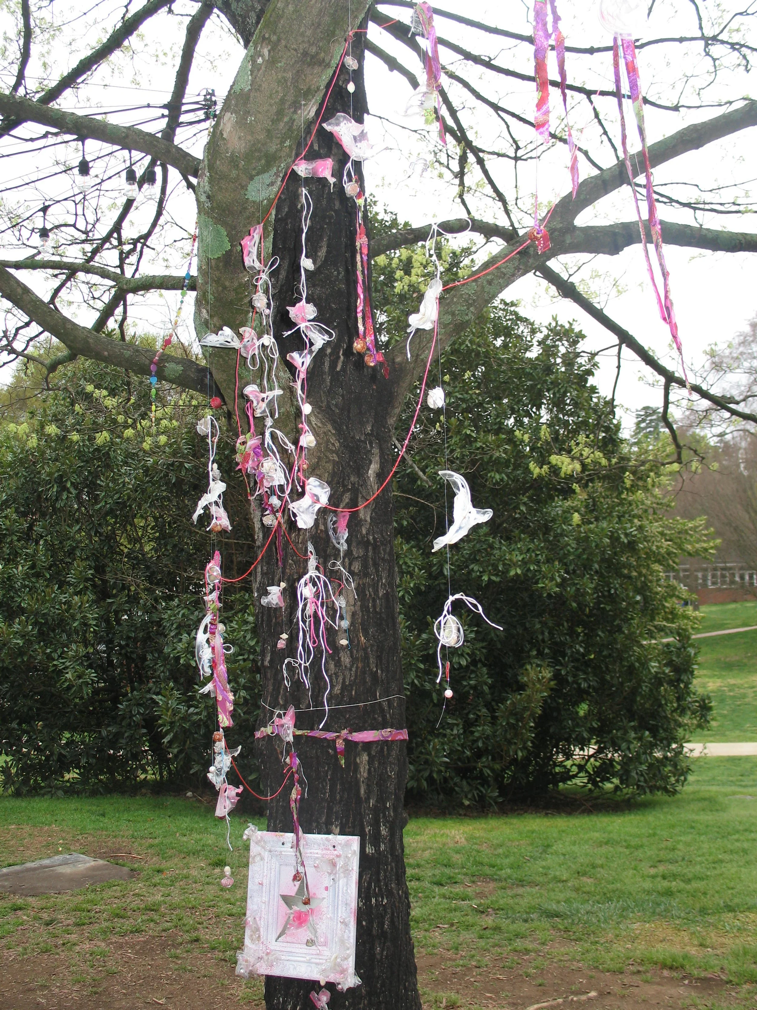 Gemeinschaft, 2025. Fishing line, beads, blow-torched cups, spray paint, and fabric