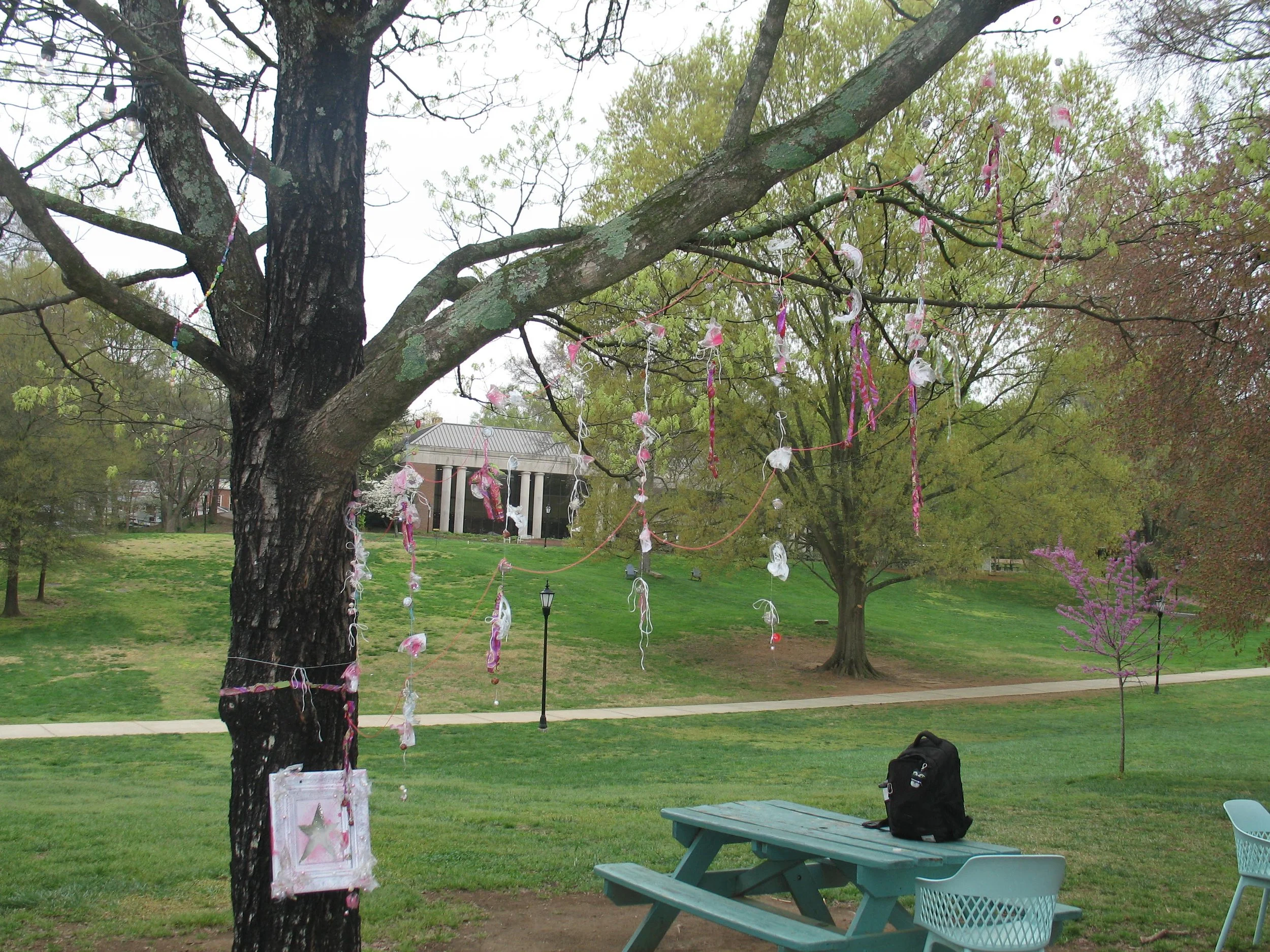 Gemeinschaft, 2025. Fishing line, beads, blow-torched cups, spray paint, and fabric