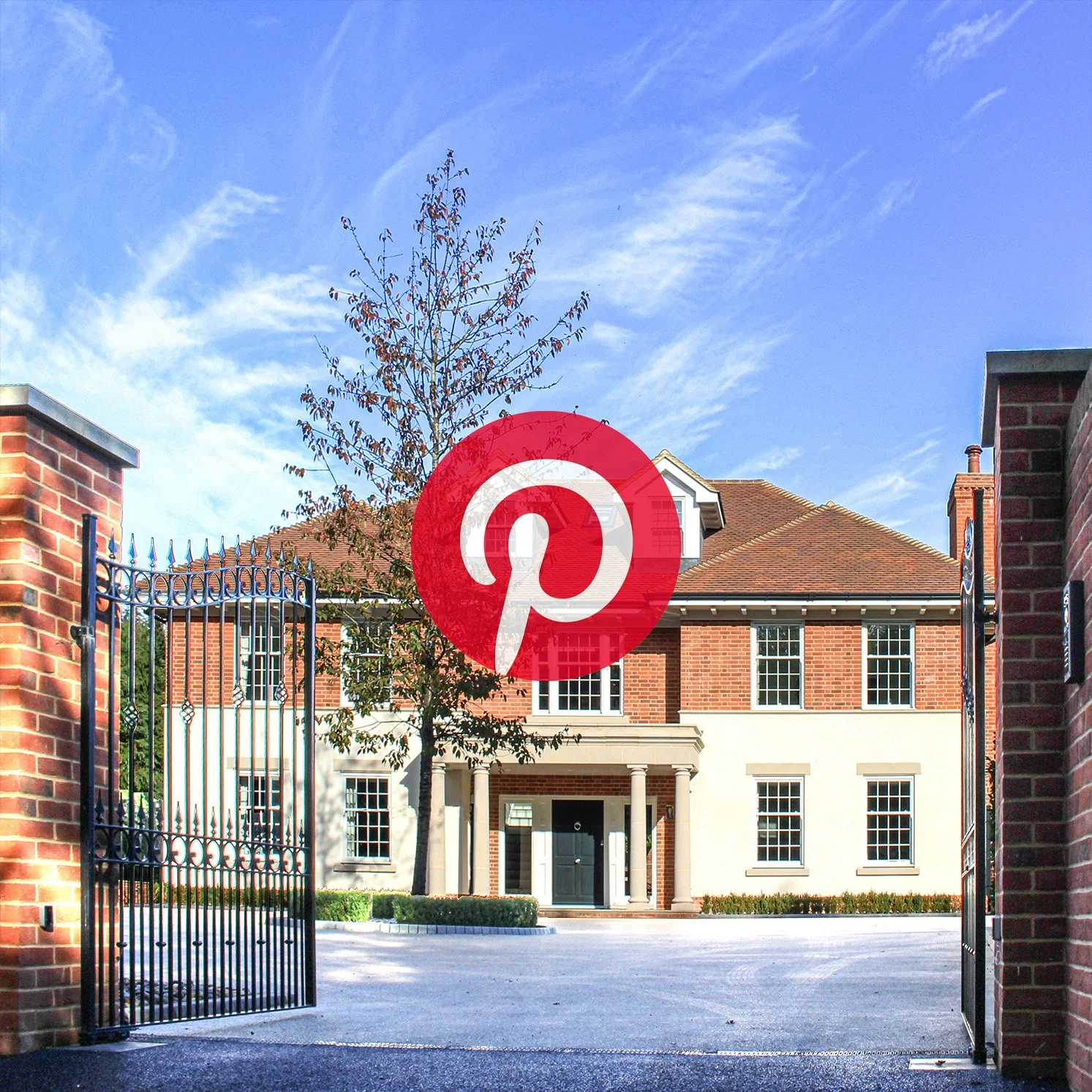 Georgian-style new build house with a stone front porch, surrounded by a brick and render. Brick piers with metal gate, designed by Tony Holt Design, a CIAT-registered architectural practice.