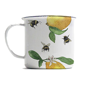 A white mug with a lemon and leaf pattern, featuring bees flying around it.