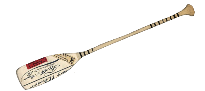 A baseball bat resting on the ground with a baseball in the background.